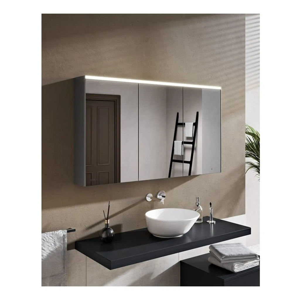 Modern bathroom with sleek black countertop, stylish vessel sink, large mirrored cabinet with LED lighting, and neutral-toned walls for a contemporary design.
