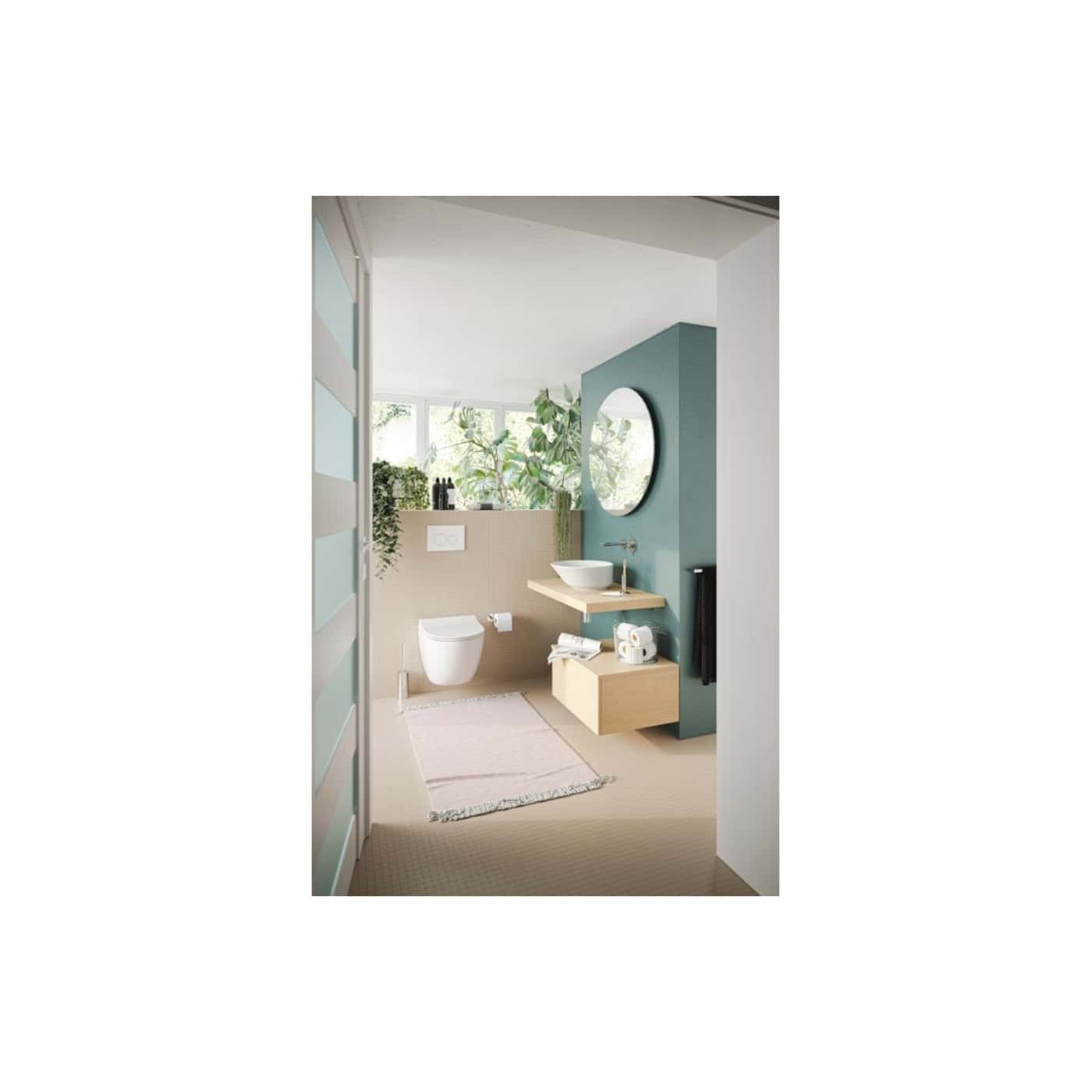 Elegant modern bathroom with wall-mounted toilet, floating wooden vanity with vessel sink, statement mirror, and lush indoor plants for a stylish and eco-friendly space.