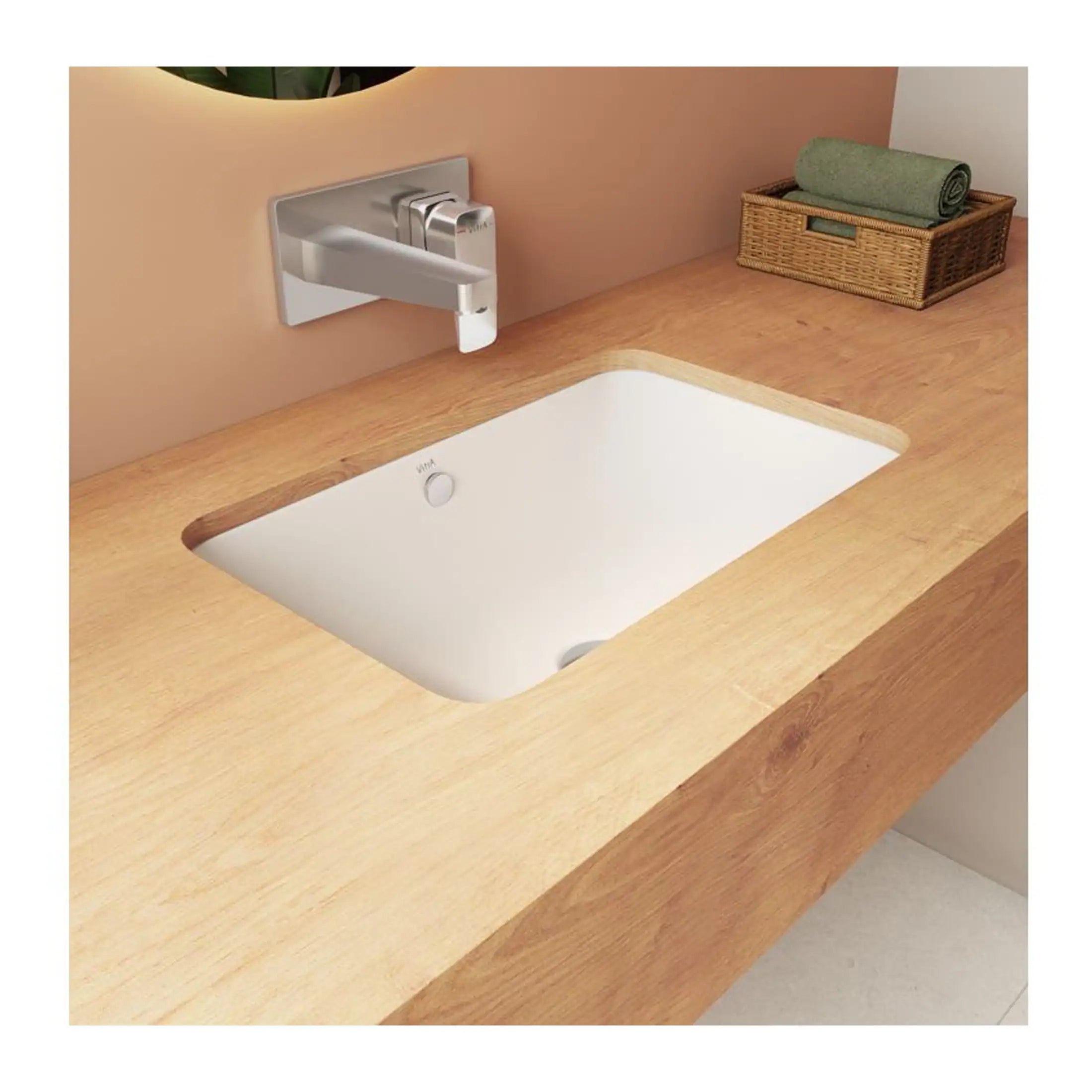 Sleek modern bathroom sink with wooden countertop and minimalist chrome tap, ideal for contemporary bathroom designs.