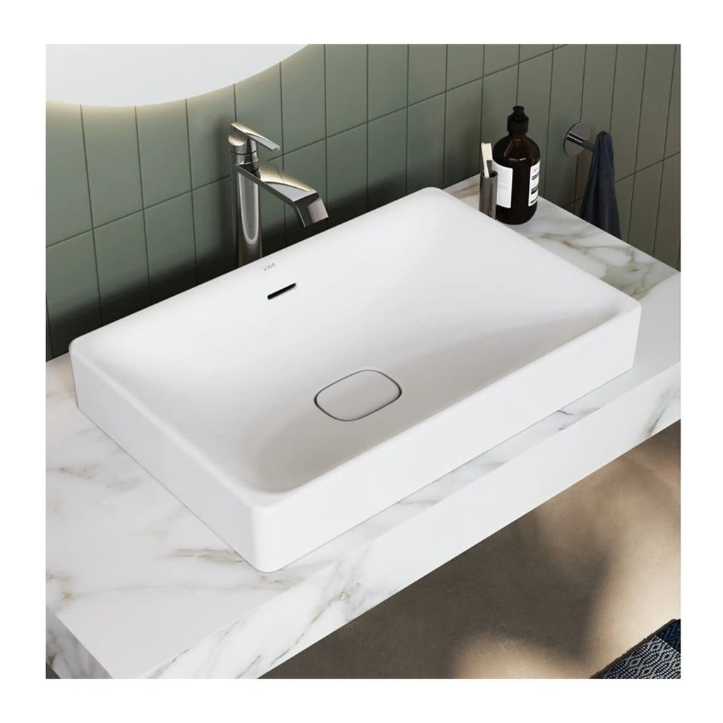 Modern white rectangular bathroom sink with a sleek chrome faucet, mounted on a marble countertop perfect for contemporary bathroom designs.