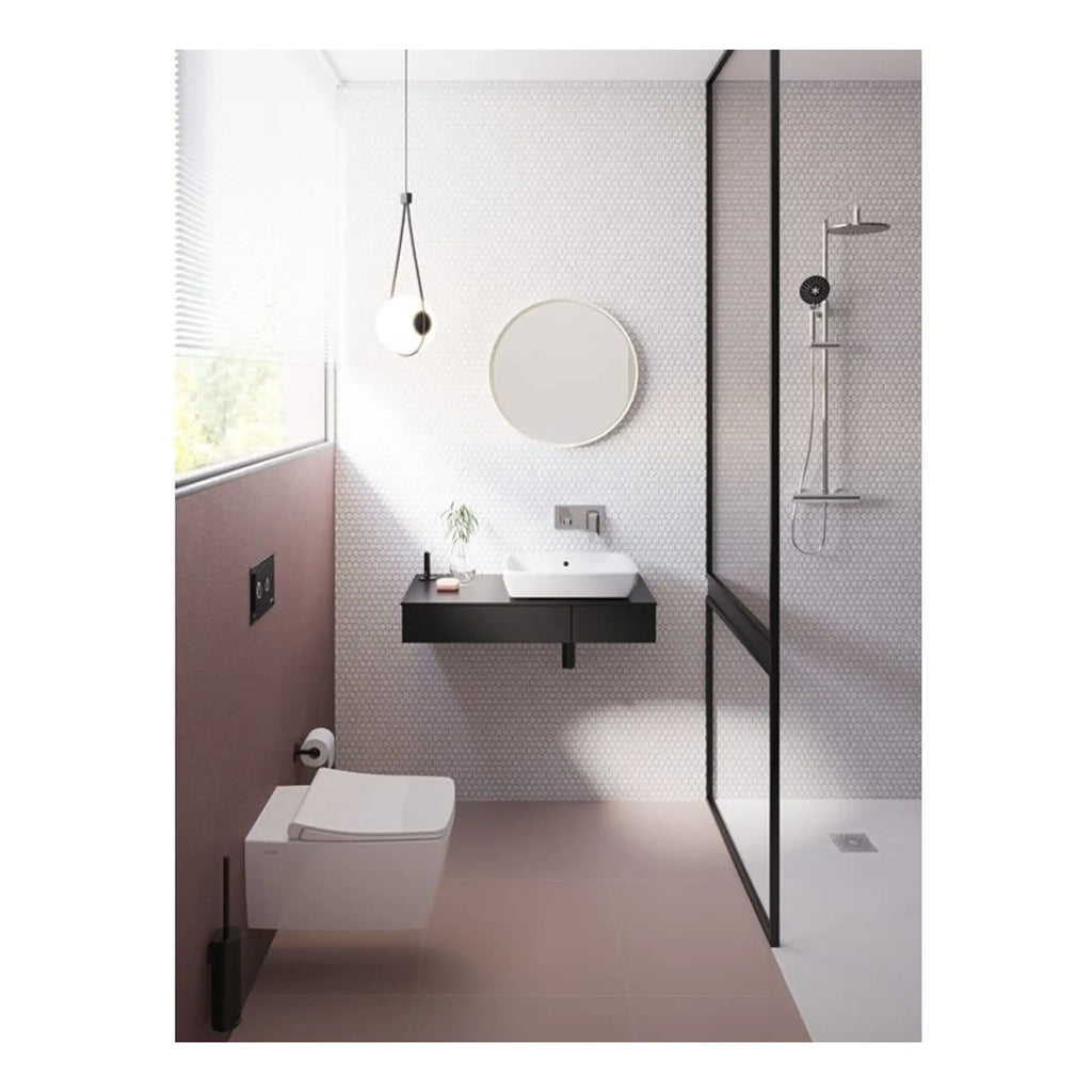 Modern minimalist bathroom with walk-in shower, wall-mounted toilet, black vanity, round mirror, and natural light. Stylish design perfect for contemporary Bubly bathrooms.