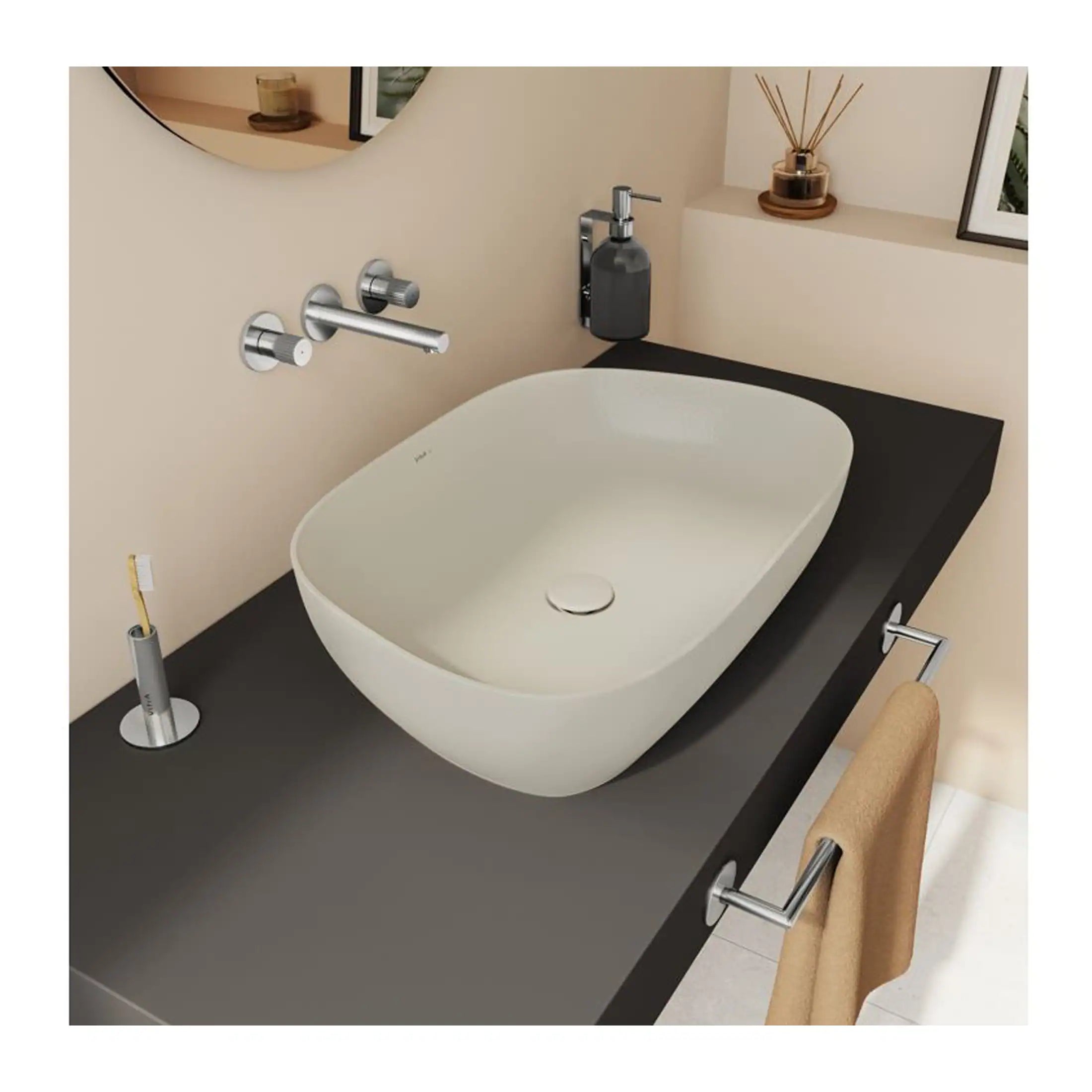 A modern bathroom sink with a sleek white vessel basin, minimalist chrome fixtures, and stylish accessories for a contemporary bathroom design.