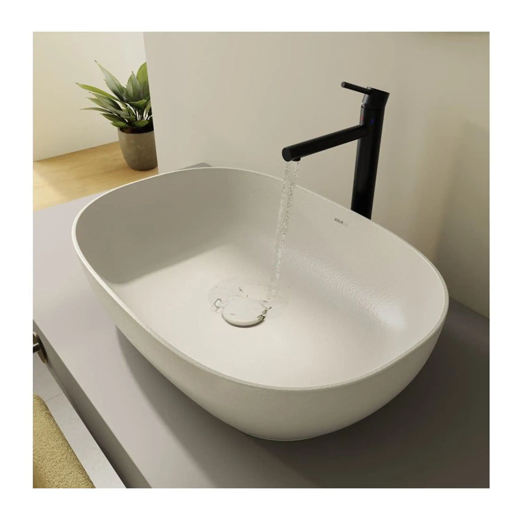 Sleek white bathroom sink with modern black tap, minimalist design, ideal for contemporary bathrooms, with a stylish water flow feature, perfect for bathroom renovation projects.