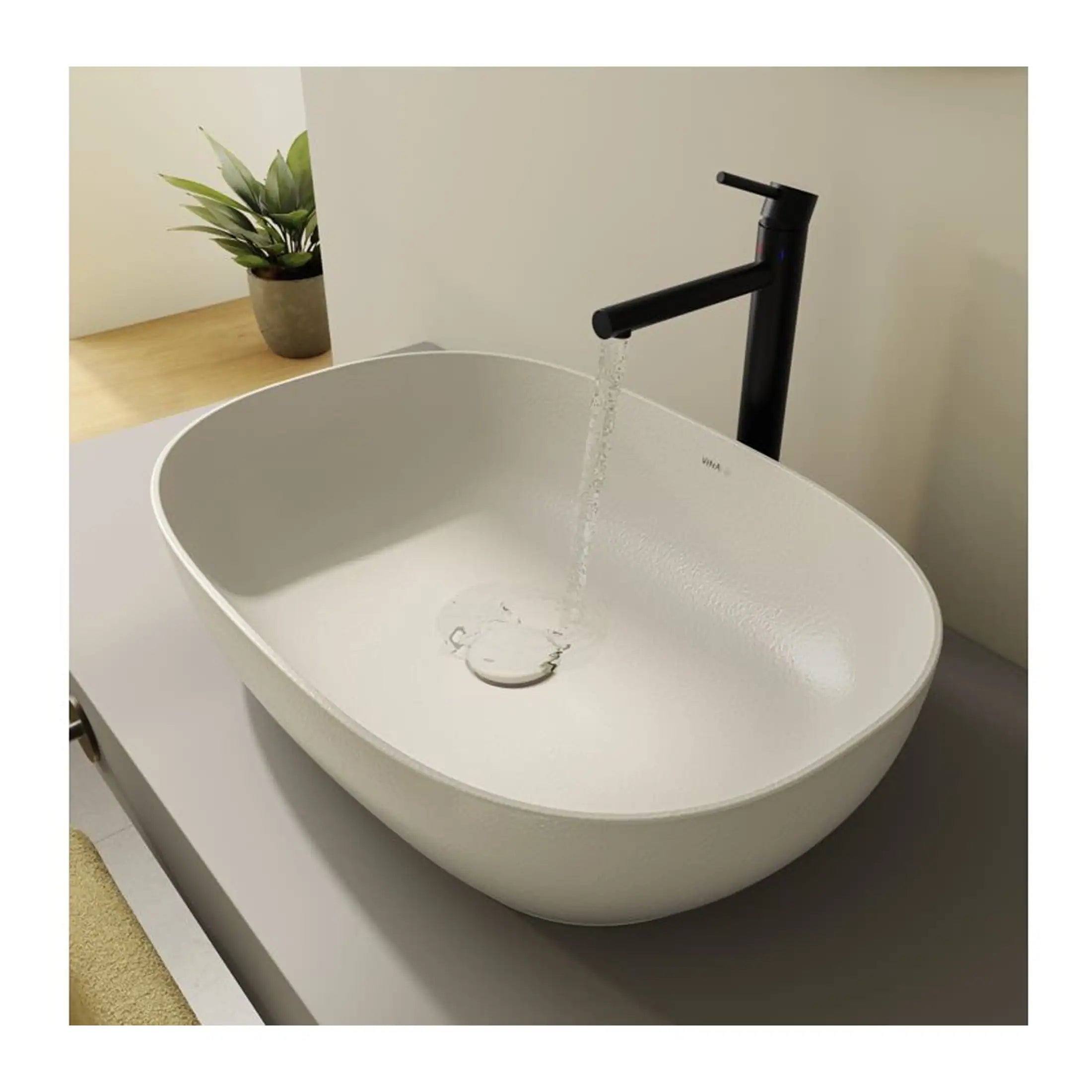 Sleek white bathroom sink with modern black tap, minimalist design, ideal for contemporary bathrooms, with a stylish water flow feature, perfect for bathroom renovation projects.
