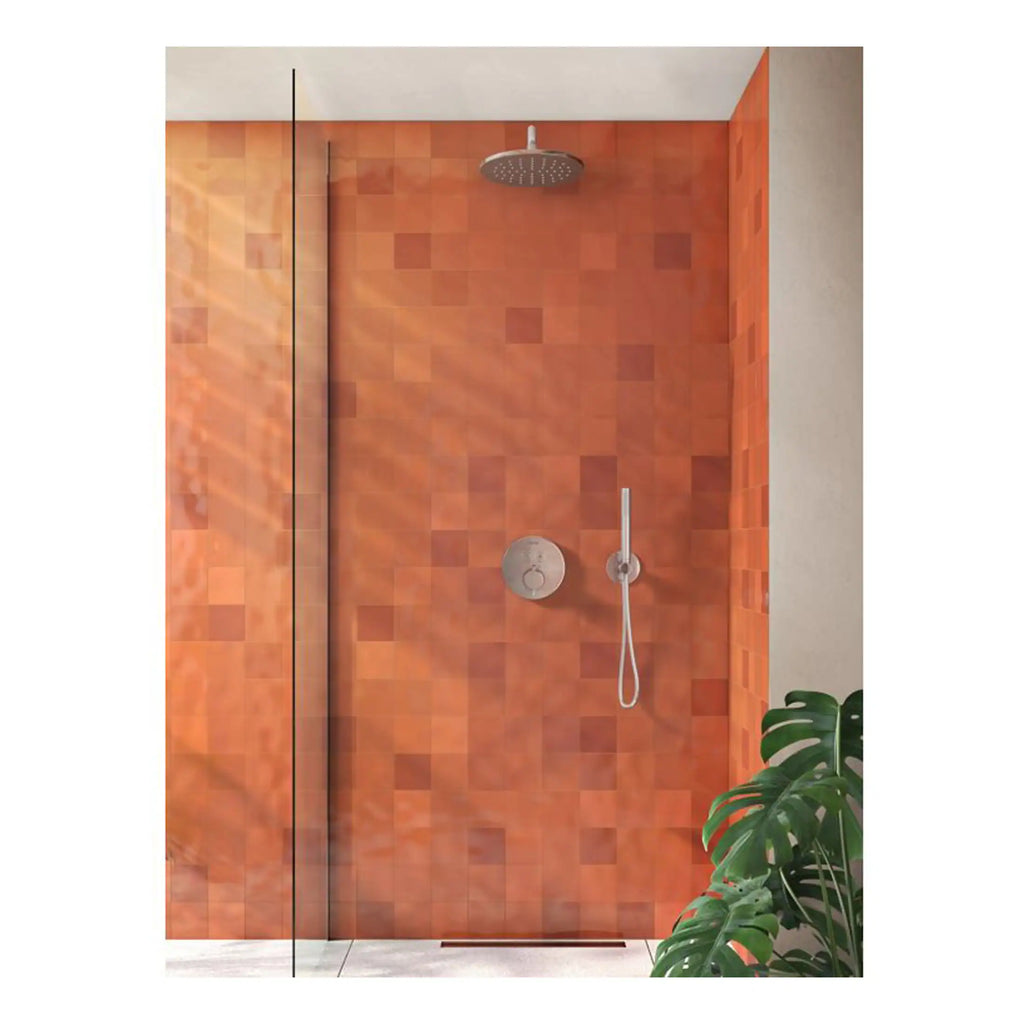 Sleek walk-in shower with orange tiles, rainfall showerhead, and adjustable handheld shower—perfect for modern bathrooms and stylish wet rooms.