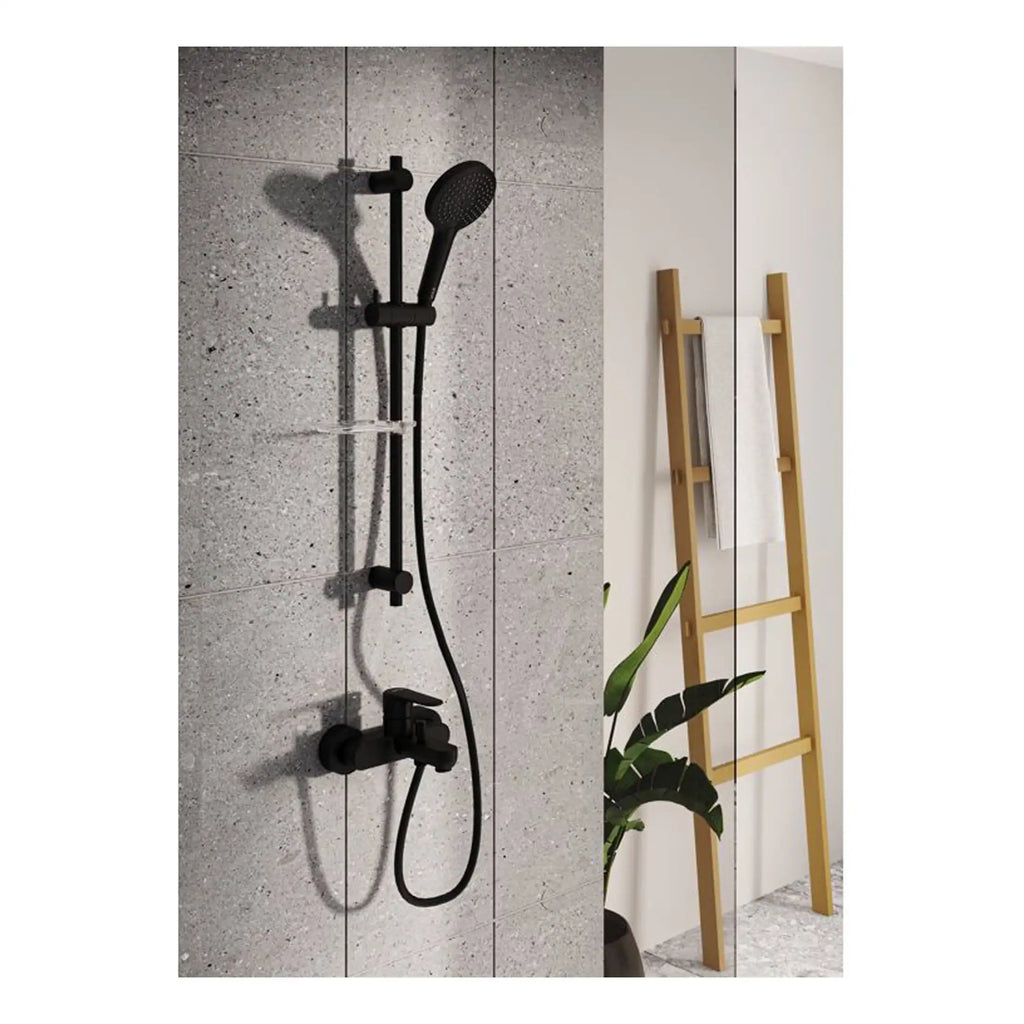 Sleek black shower fixtures with handheld showerhead on textured grey tiled wall, combined with modern wooden towel ladder and greenery, creating a stylish and functional bathroom space.