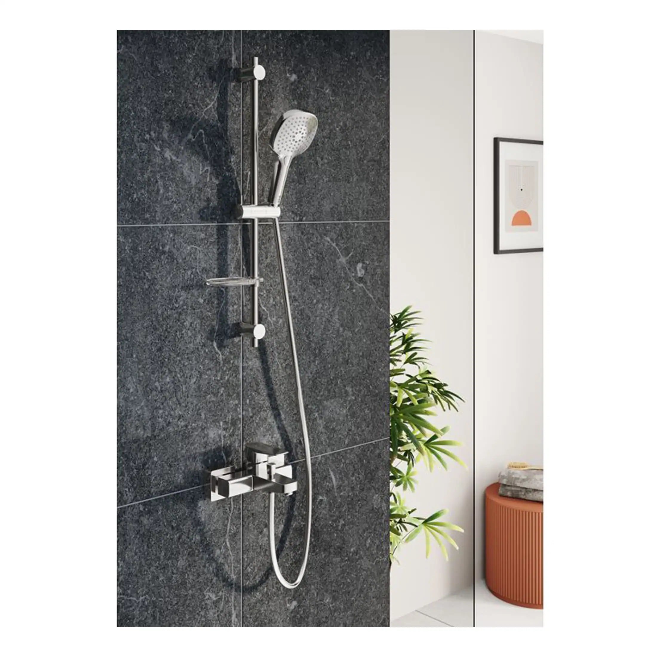 Modern chrome shower system with handheld shower head and adjustable slide on a dark stone tiled wall in a contemporary bathroom.