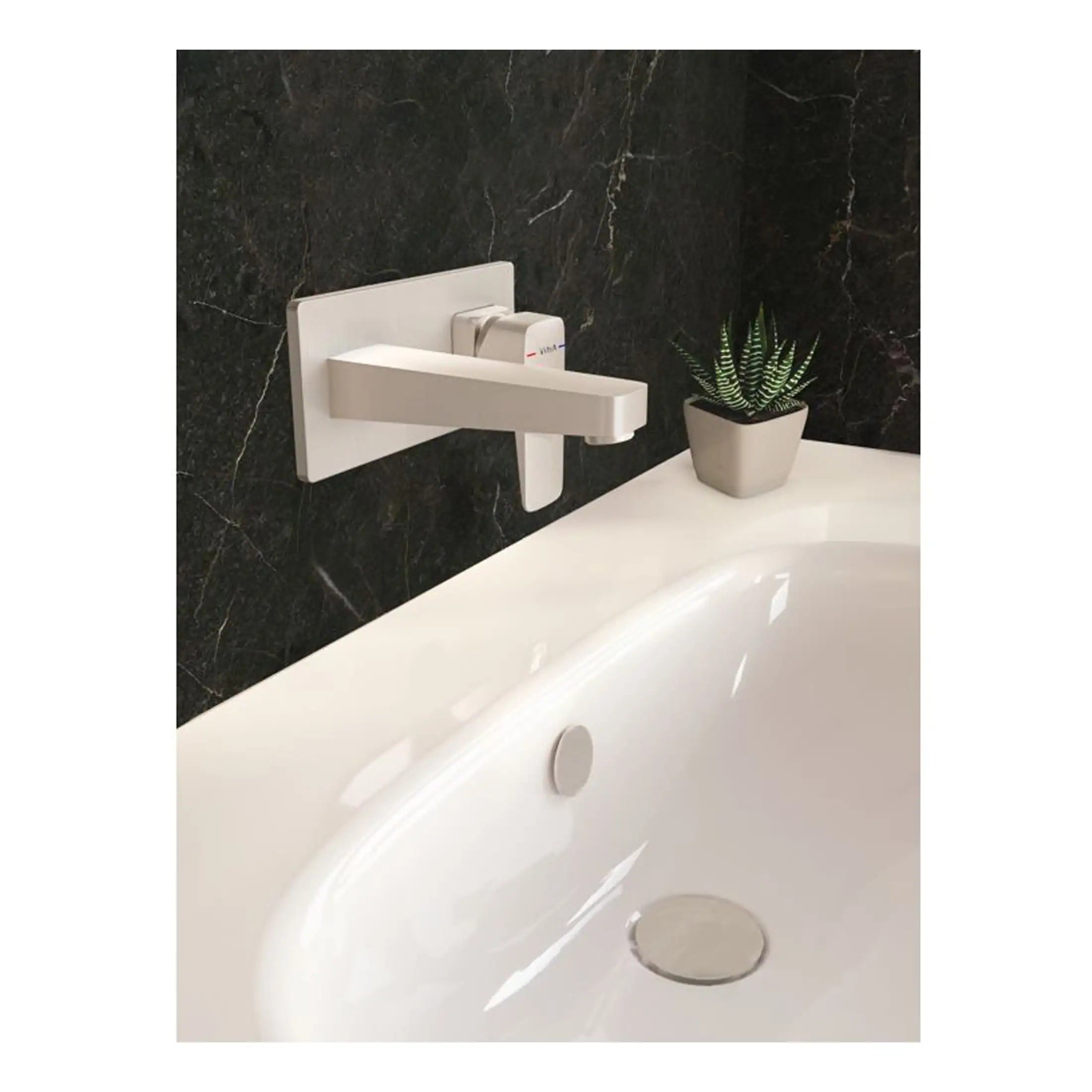 Sleek white bathroom tap with black marble wall background, modern design for luxurious bathroom decor.