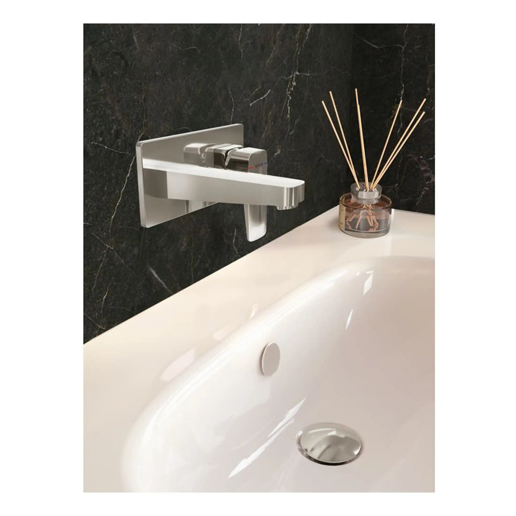 Sleek modern bathtub faucet and black marble wall with reed diffuser, stylish bathroom decor, luxury bathroom fixtures, minimalistic design, premium quality bath accessories.