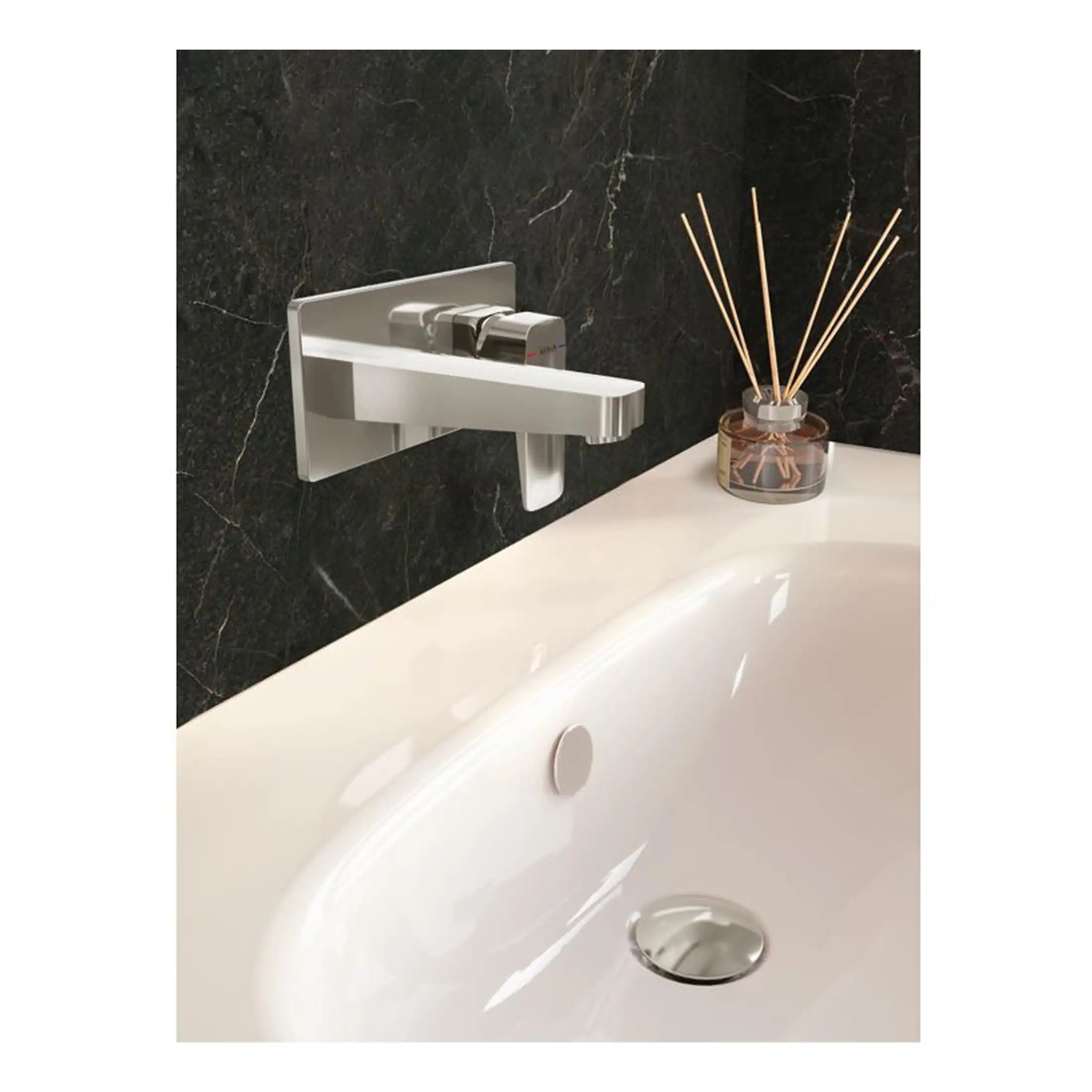 Sleek modern bathtub faucet and black marble wall with reed diffuser, stylish bathroom decor, luxury bathroom fixtures, minimalistic design, premium quality bath accessories.