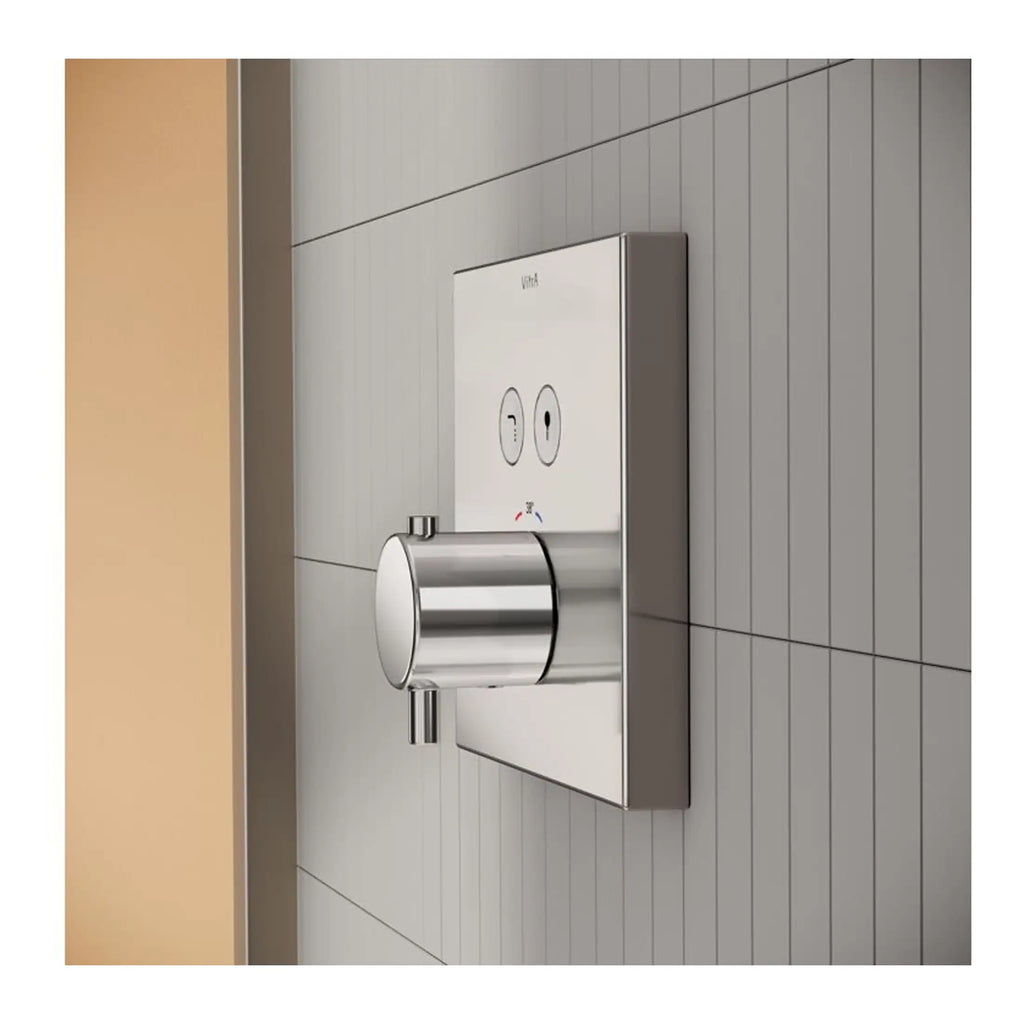 Sleek stainless steel bathroom flush plate with modern design, suitable for contemporary bathrooms and accessible toilet systems.