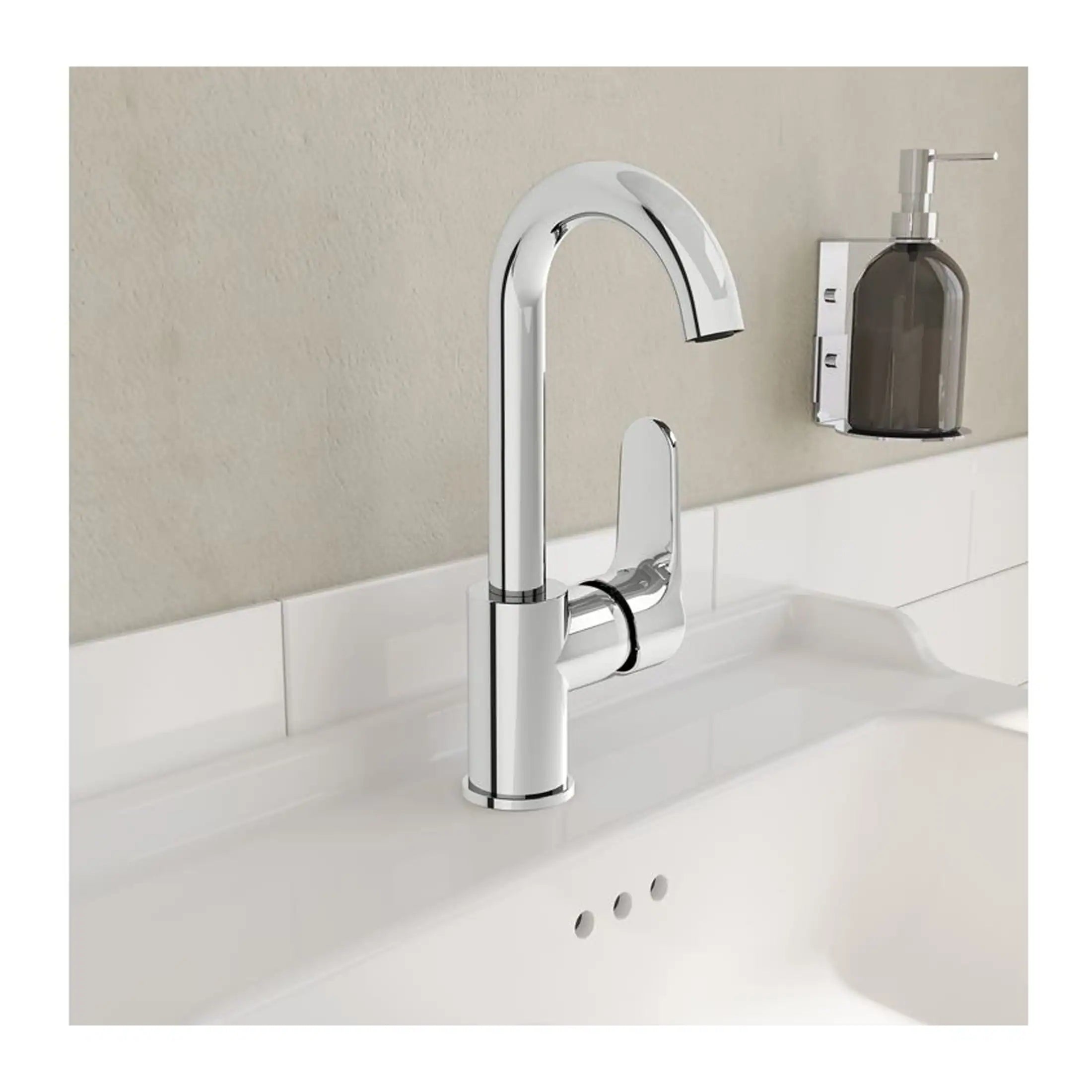Sleek chrome kitchen sink tap with modern design, mounted on a white bathroom countertop with beige wall background.