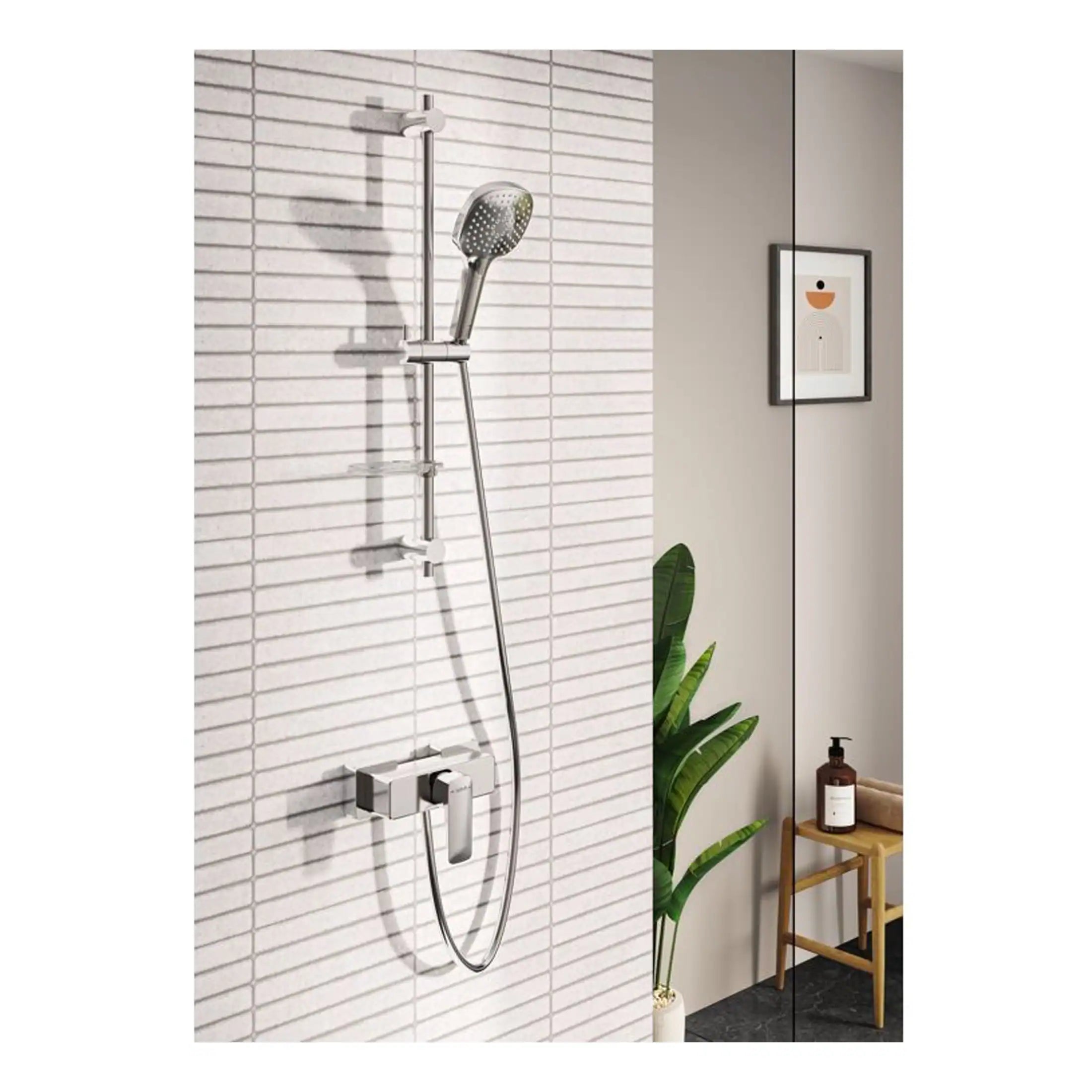 Modern chrome shower system with adjustable handheld showerhead on a tiled bathroom wall, complemented by minimalist decor including a potted plant and framed artwork.