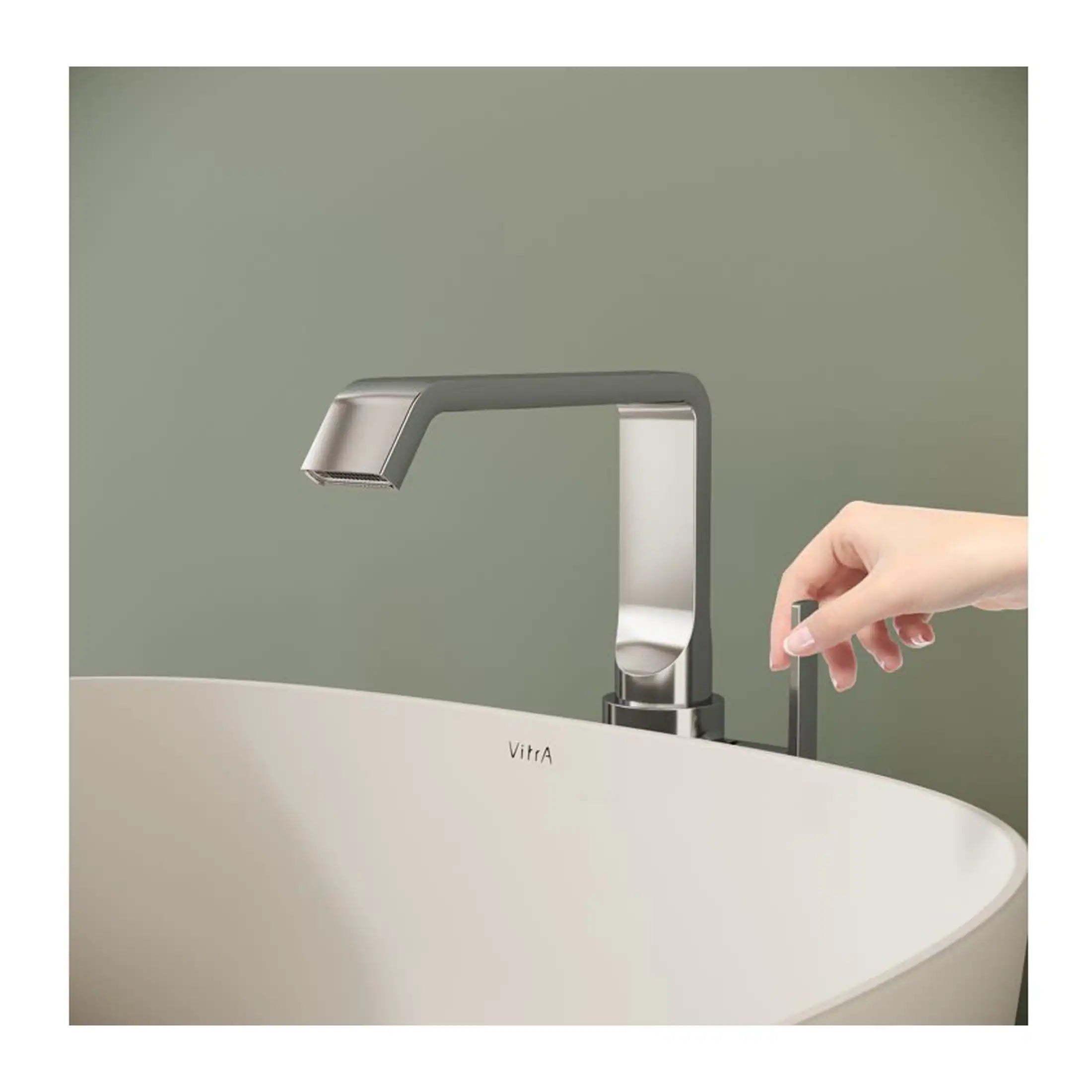 Sleek modern bathroom sink with a brushed nickel faucet and gesture sensor for touchless operation, designed for contemporary bathroom settings.