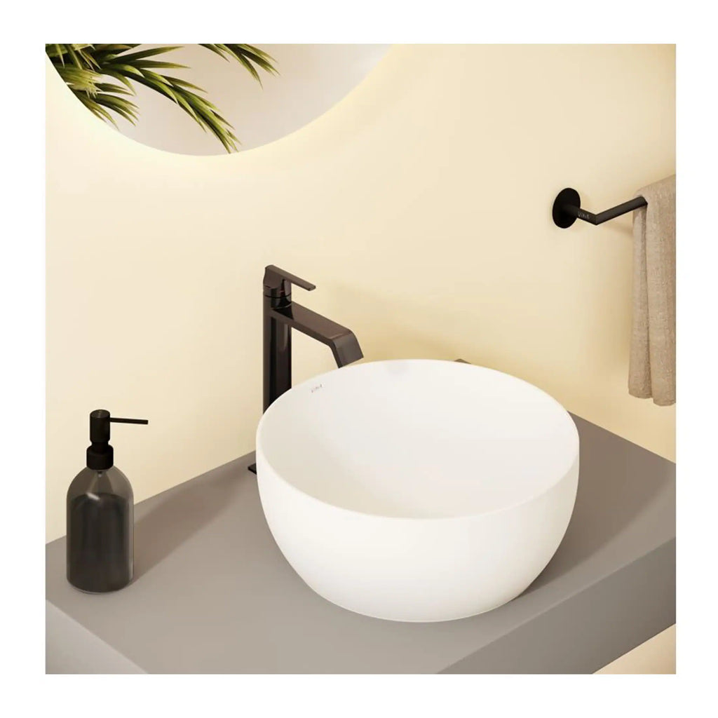 Sleek white vessel bathroom sink with matte black faucet and matching soap dispenser, modern minimalist design for luxurious bathrooms.
