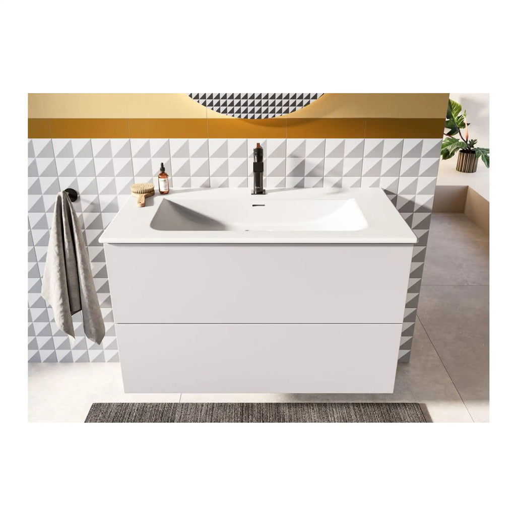 Sleek modern white bathroom vanity with integrated sink and black faucet, decorated with trendy wall tiles, perfect for contemporary bathroom designs.