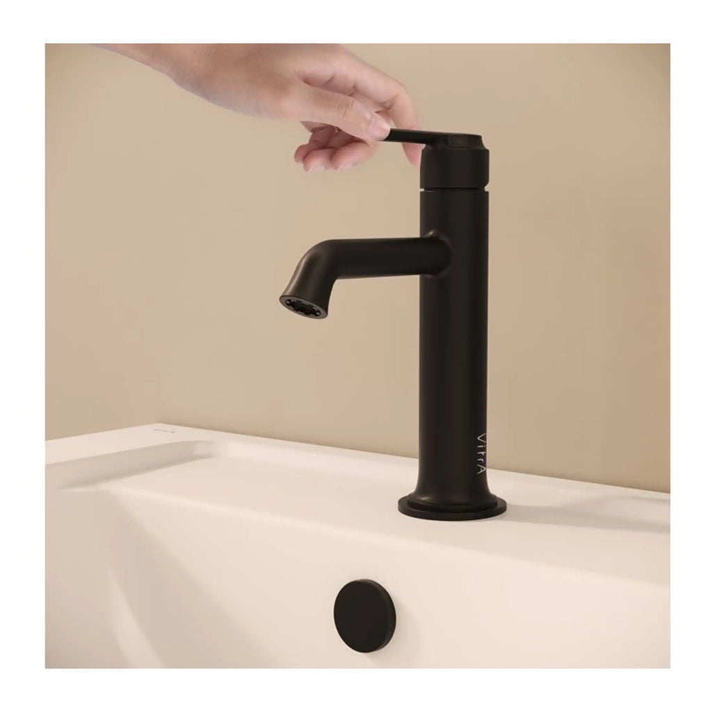 Sleek black bathroom sink mixer tap with a modern minimalist design, installed on a white basin for contemporary bathroom aesthetics. Perfect for stylish bathroom renovations.