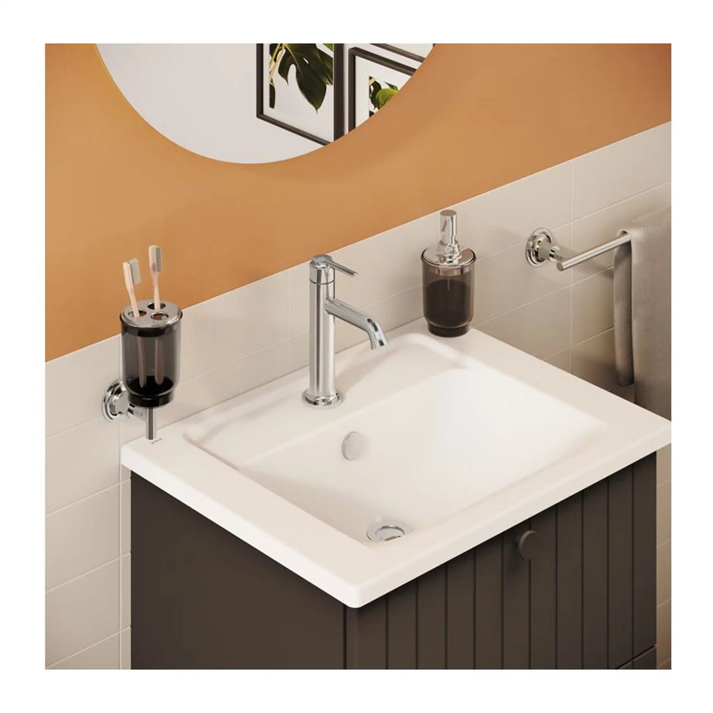 Toothbrush holder and soap dispenser on a modern bathroom sink with mirror, designed for stylish and functional bathroom decor.