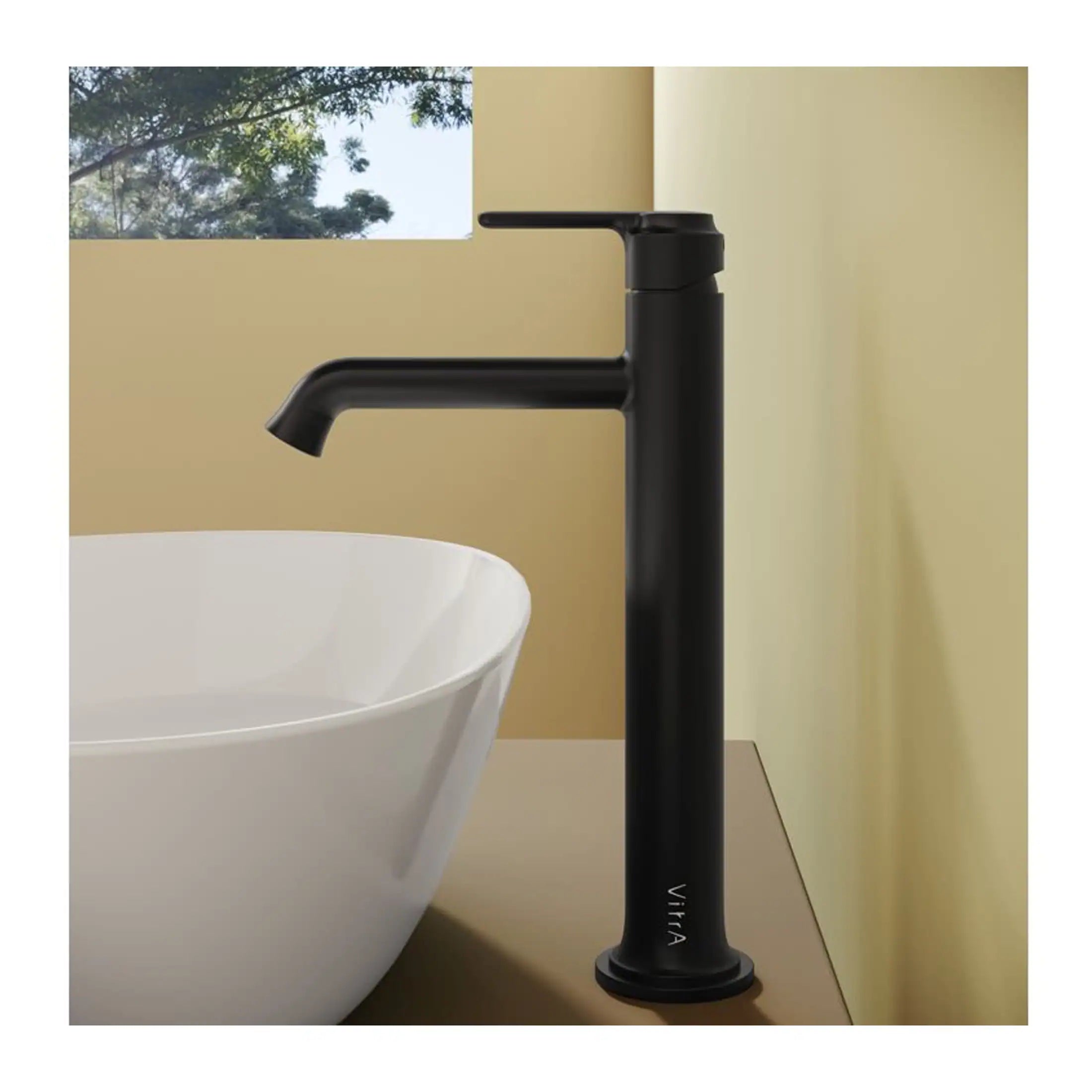 Sleek black bathroom tap with modern minimalist design, installed above a white vessel sink in a contemporary bathroom setting.