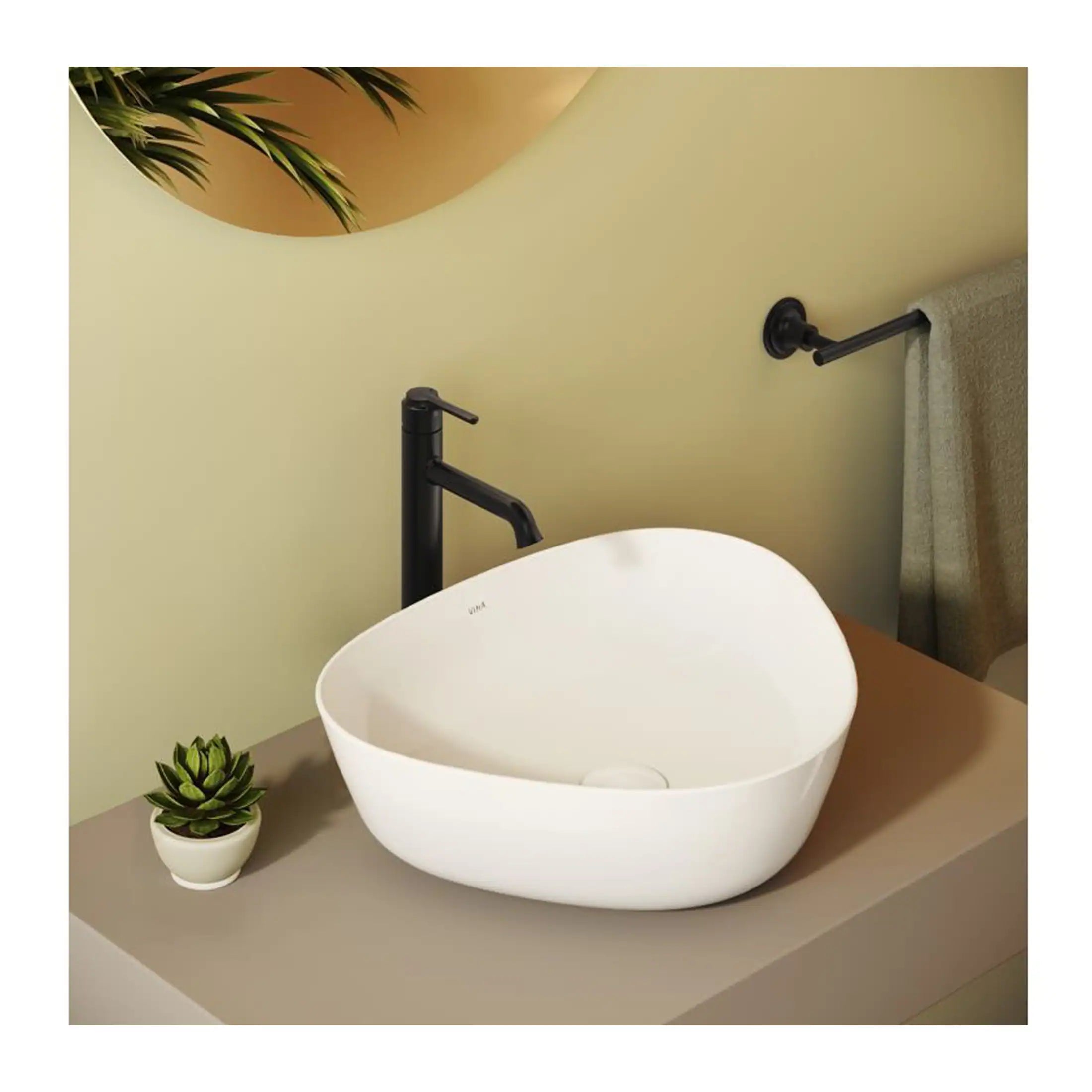 Sleek white basin with matte black faucet and modern bathroom decor on a beige countertop, featuring a small potted plant. A stylish bathroom sink setup showcasing contemporary design and elegant fixtures.