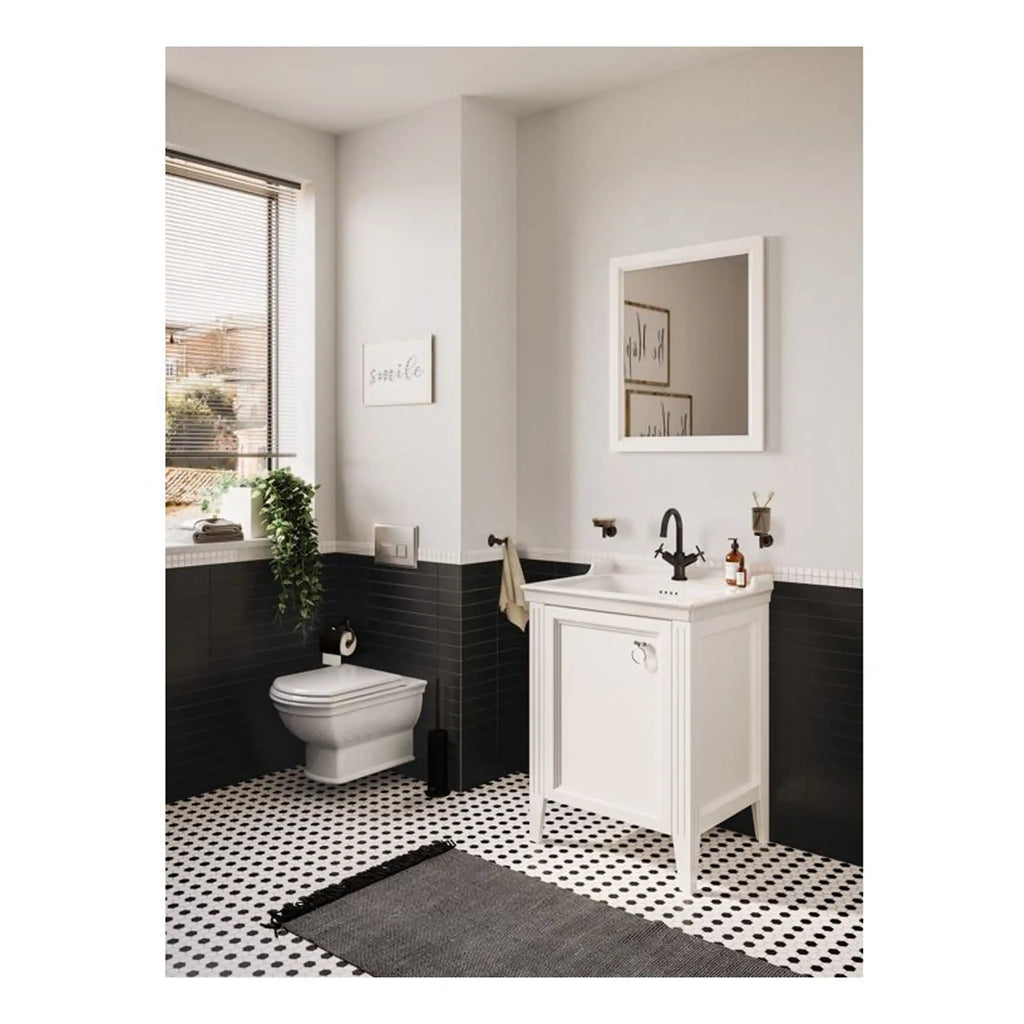 Bright modern bathroom with black and white tiled flooring, sleek white toilet, and a stylish vanity with black fixtures; featuring a large window and decorative wall art, creating a clean, minimalist aesthetic.