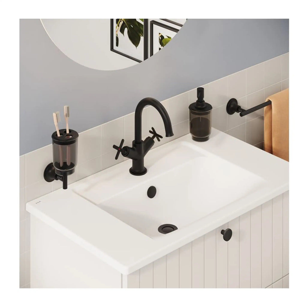 Sleek black bathroom tap and accessories set with toothbrush holder, soap dispenser, and towel rail against white tiled wall, modern and stylish bathroom design.