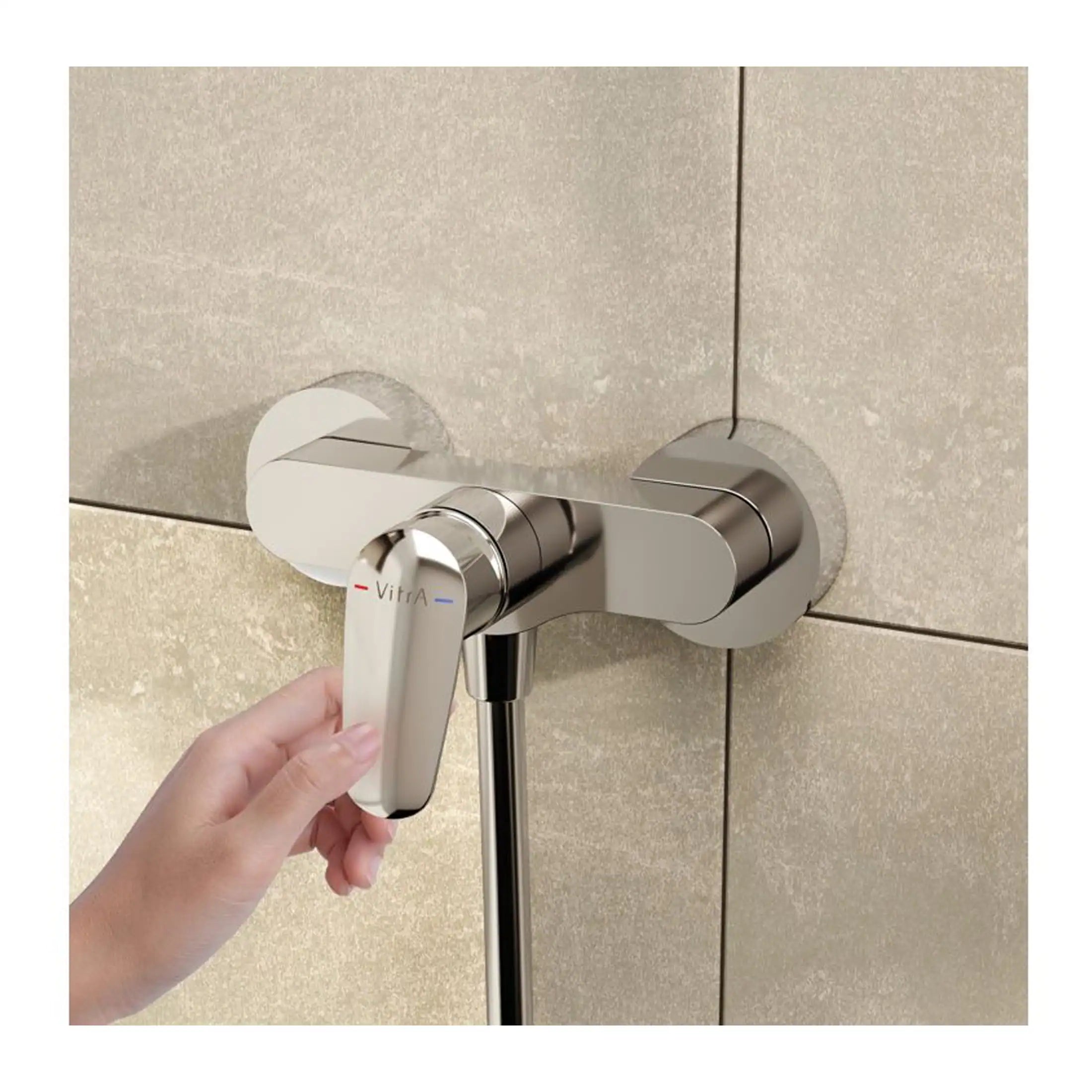 Modern chrome bathroom mixer tap with a hand adjusting the temperature, installed on a tiled wall, showcasing premium bathroom fittings and fixtures.