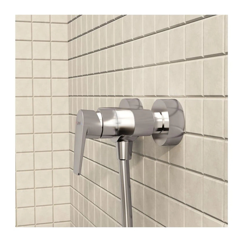 Sleek stainless steel bathroom tap with modern design, wall-mounted fixture for contemporary shower or bath, installed on beige tiled wall, showcasing durable and stylish bathroom fittings.