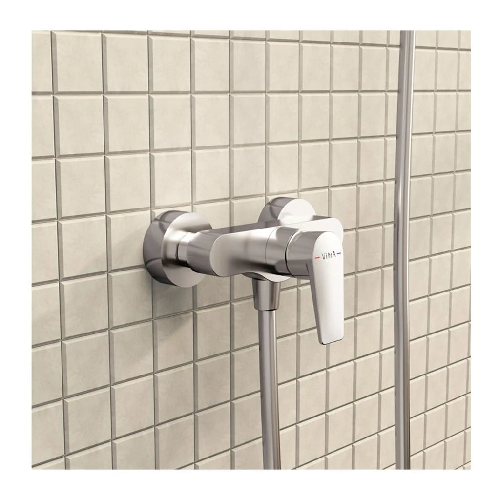 High-quality modern shower mixer tap with vintage design mounted on tiled wall in a stylish bathroom setting.