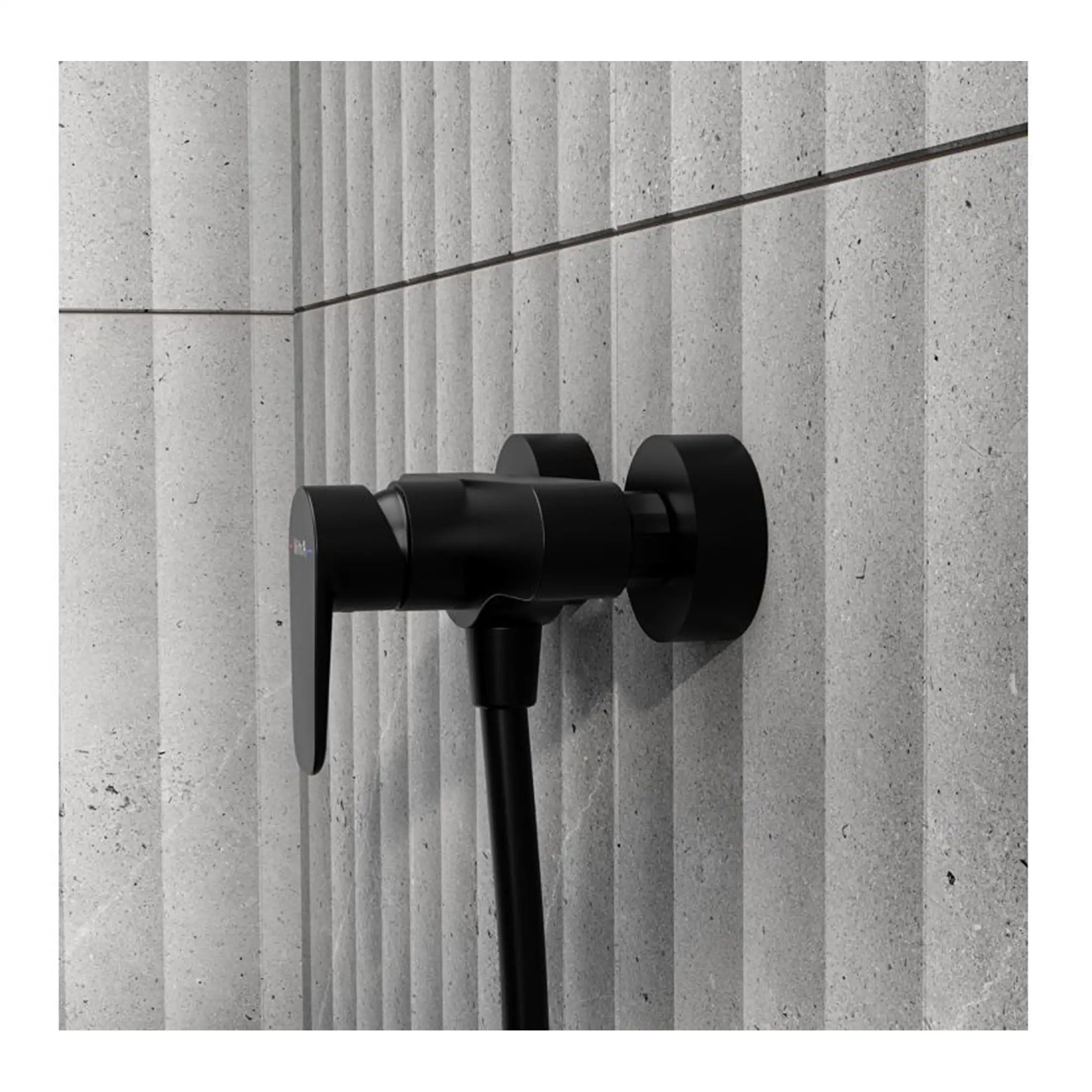 Sleek black bathroom hot and cold water mixer tap mounted on textured grey wall tiles, modern bathroom fixtures, minimalist design.