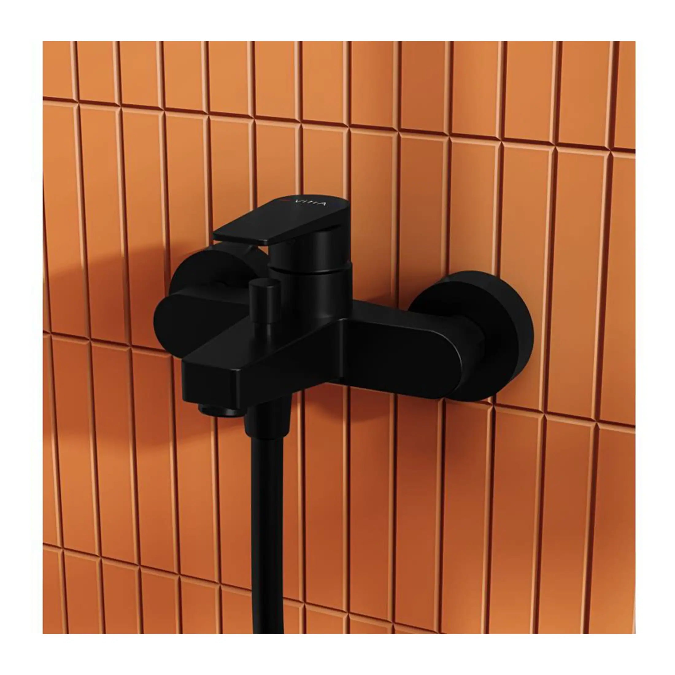 Black modern wall-mounted bathroom tap with a matte finish against orange tiled background.