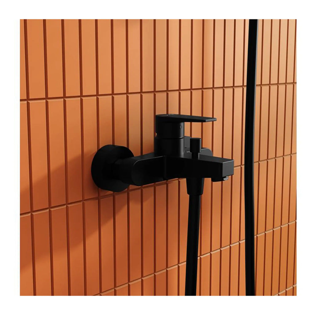 Black bathroom mixer tap and shower set on a terracotta tiled wall, modern water fixtures for stylish bathroom design.