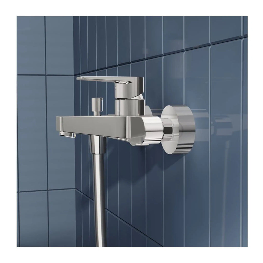 Brushed chrome wall-mounted bathroom faucet with modern design, installed on a blue tiled wall, ideal for contemporary bathroom setups.