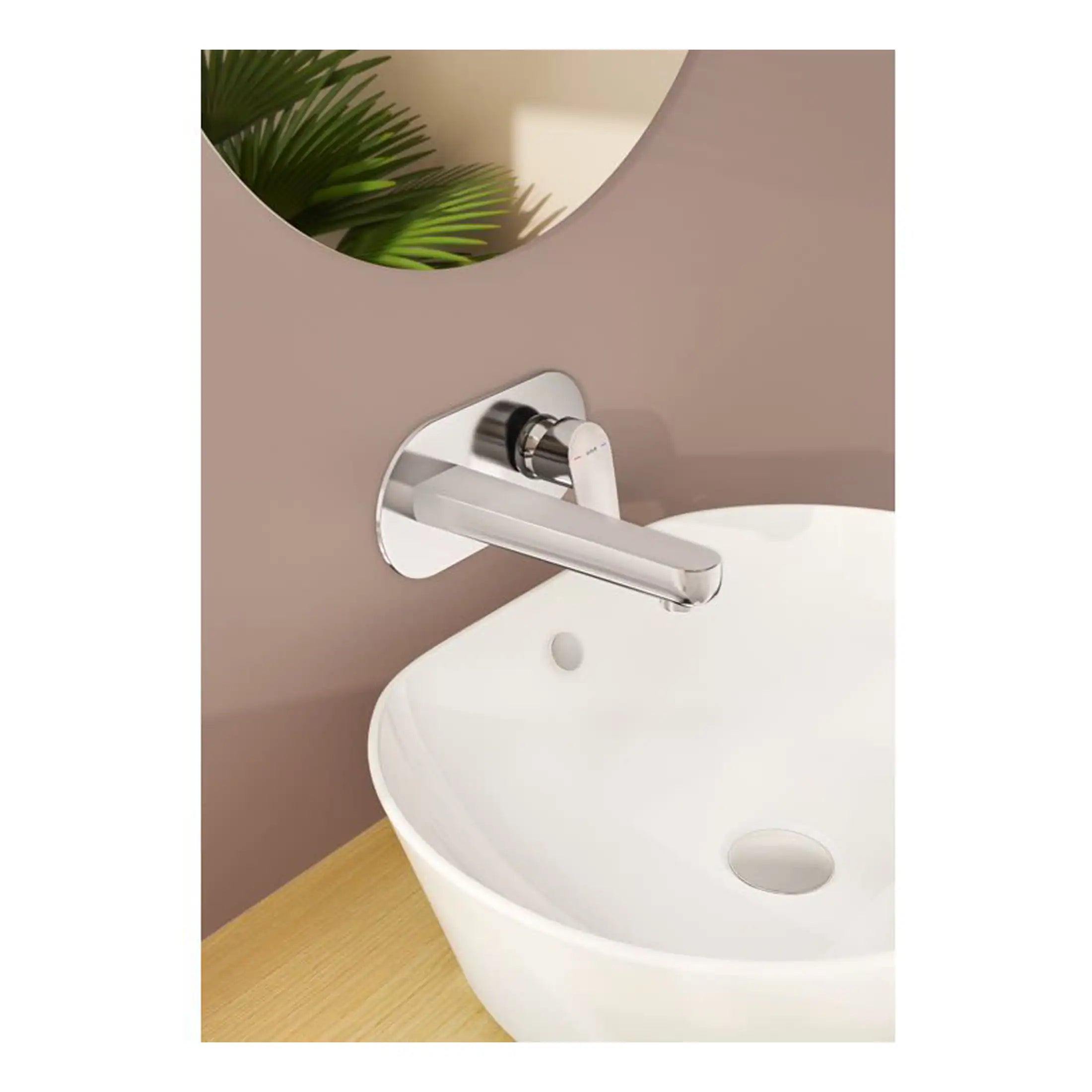 Sleek modern chrome bathroom tap mounted on beige wall with a white vessel sink below, complemented by a round mirror and green plant, showcasing contemporary bathroom design with stylish fixtures.