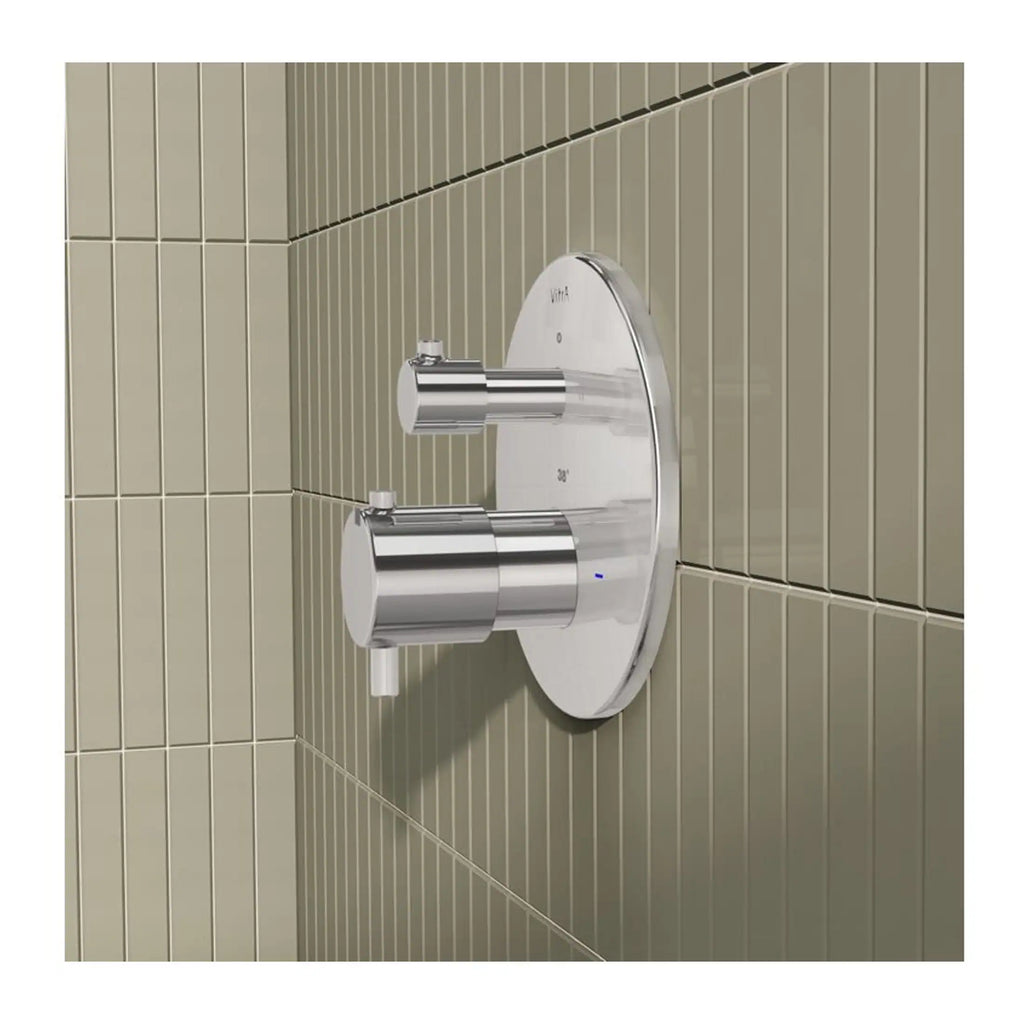Sleek modern chrome bathroom tap with temperature and pressure controls, mounted on beige tiled wall for a contemporary aesthetic.