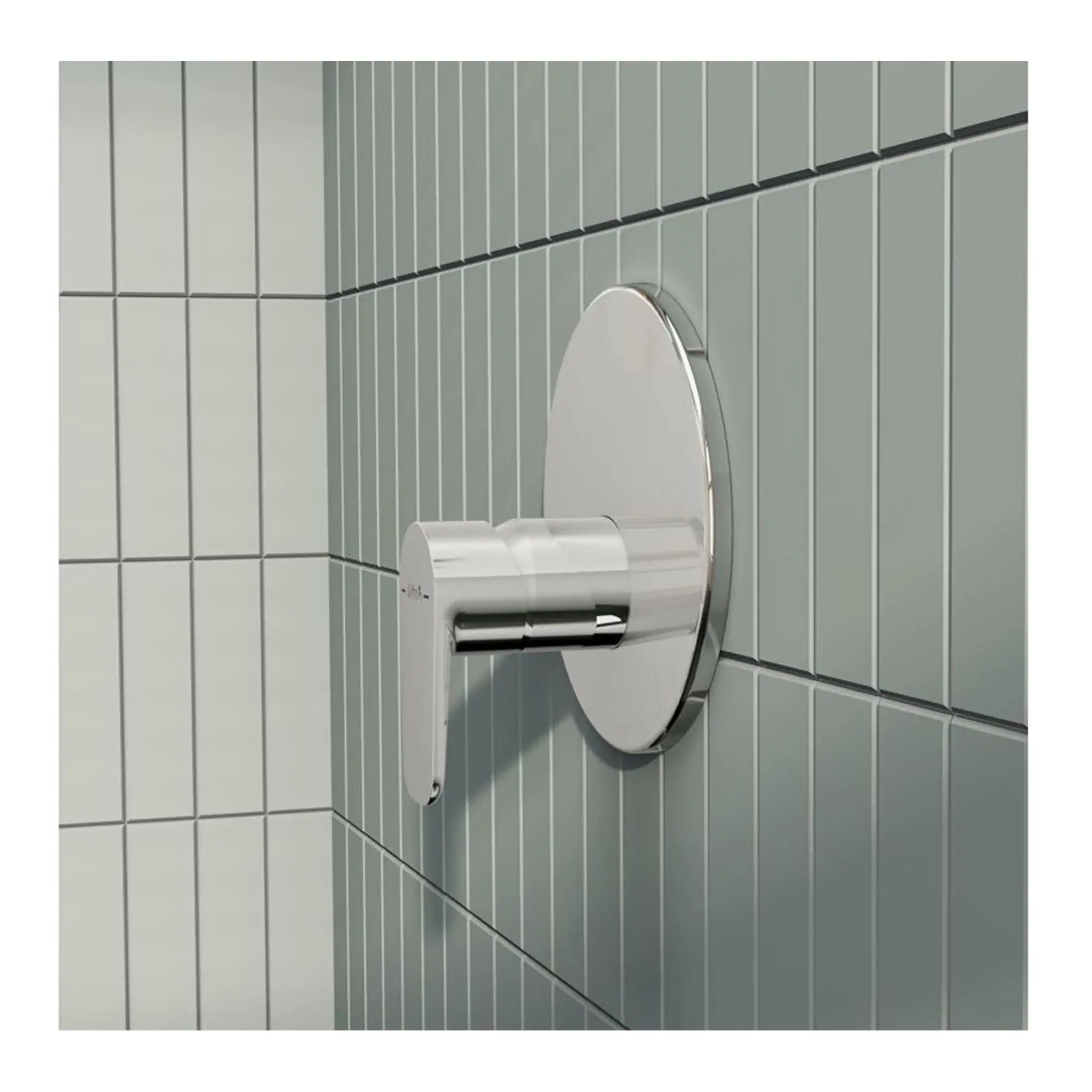 Modern stainless steel automatic hand dryer in a contemporary bathroom setting with grey tiled walls.