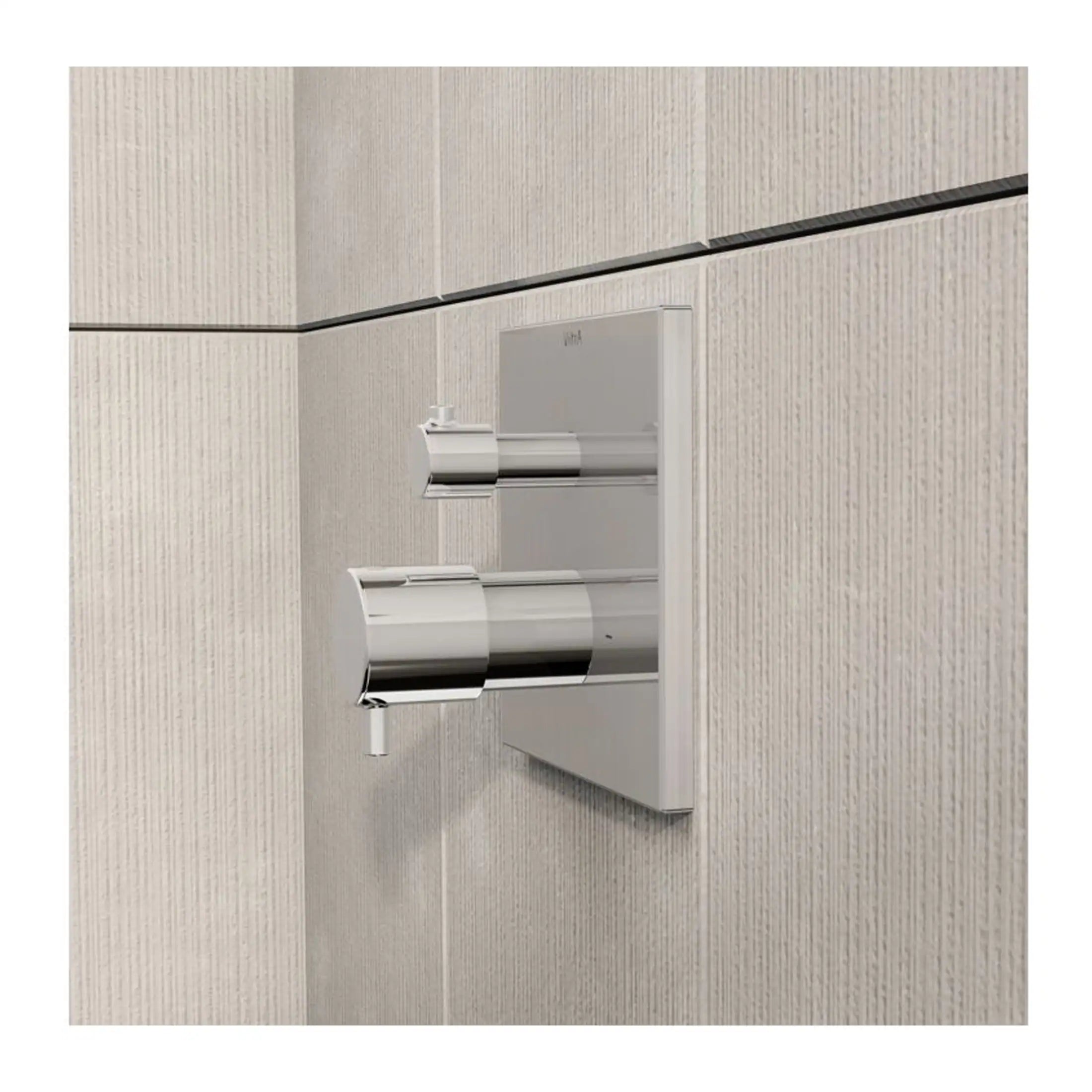 Sleek modern dual flush toilet flush buttons with chrome finish on textured beige wall tiles, perfect for contemporary bathroom design.