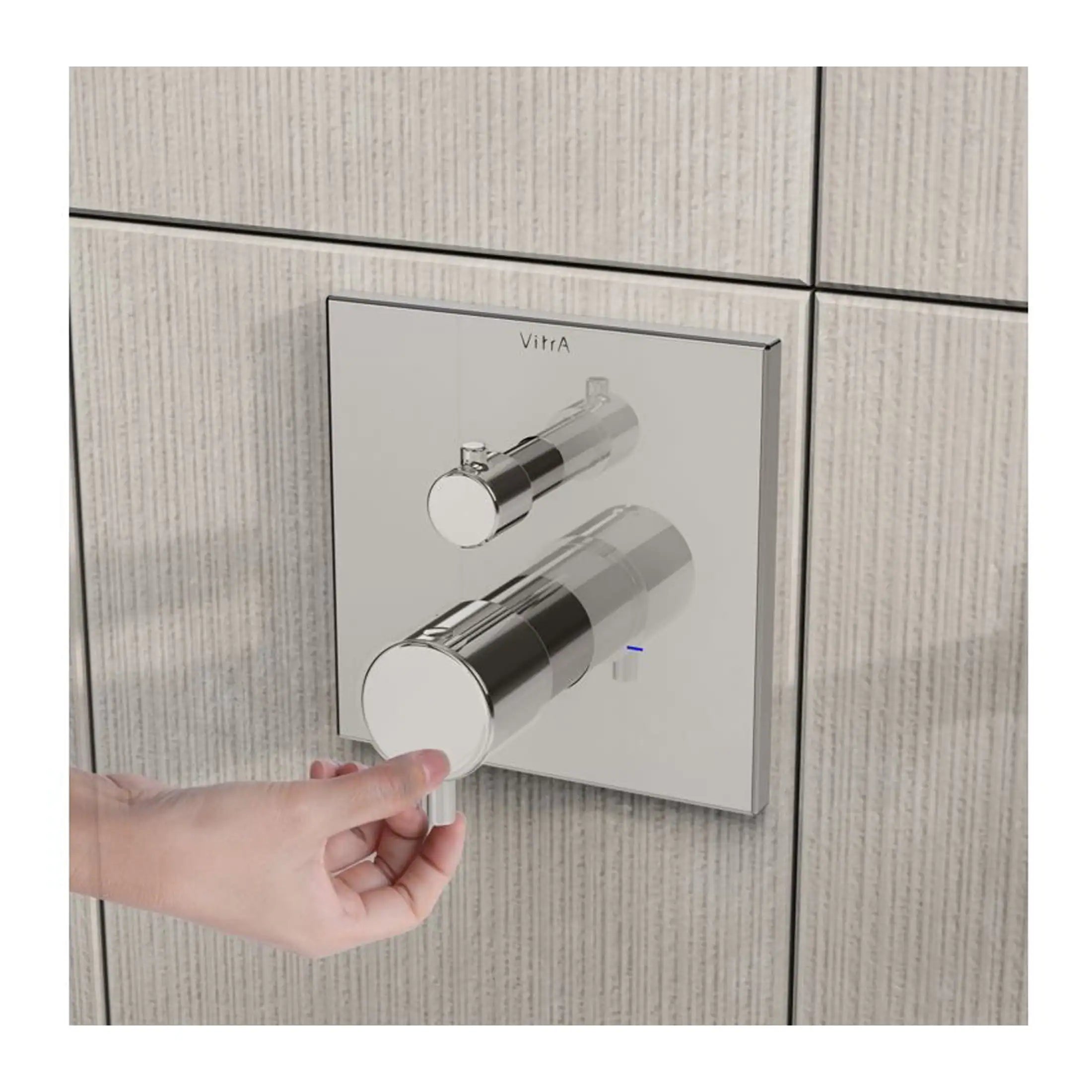 Sleek modern bathroom flush mechanism with chrome finish, installed on tiled wall, providing a stylish and functional solution for toilet flushing.