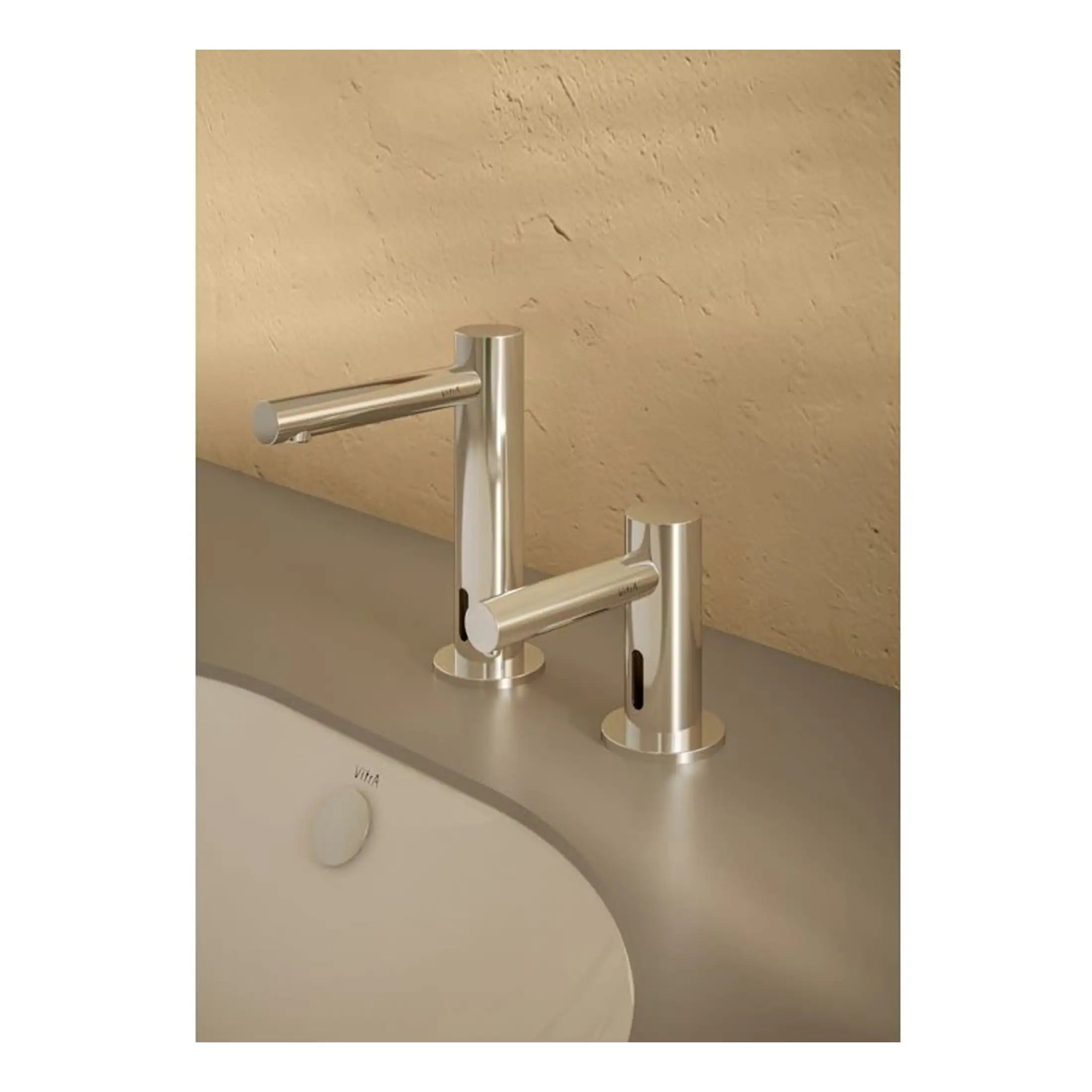 Sleek modern stainless steel bathroom tap set with two separate spouts and ergonomic handles, ideal for contemporary bathroom basin or sink design.