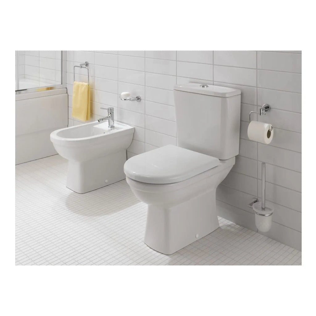 Toilet, bidet, and bathroom accessories in a modern, white tiled bathroom setting at Bubly Bathrooms, showcasing clean and minimalistic bathroom fixtures for contemporary interior design and bathroom renovations.