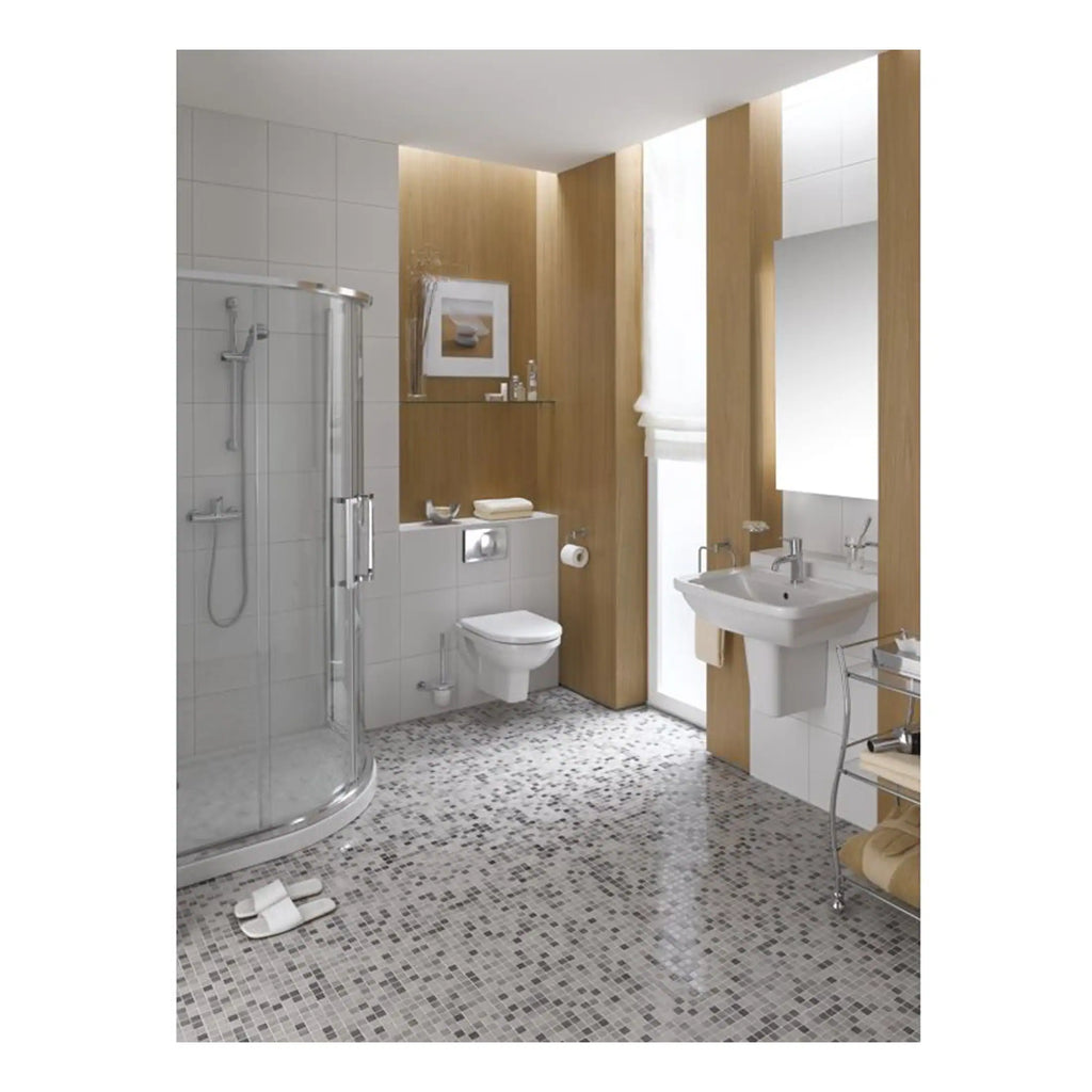 Modern bathroom with walk-in shower, white toilet, washbasin, and wooden accents, featuring contemporary fixtures and mosaic flooring for luxury bathroom design.