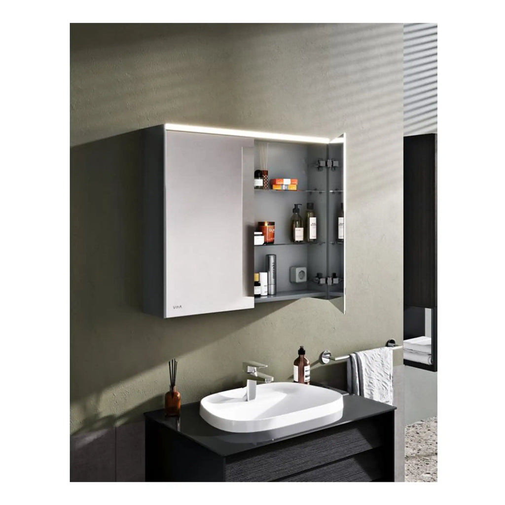 Sleek modern bathroom cabinet with integrated lighting and glass shelves, perfect for storing toiletries in a contemporary bathroom setting.