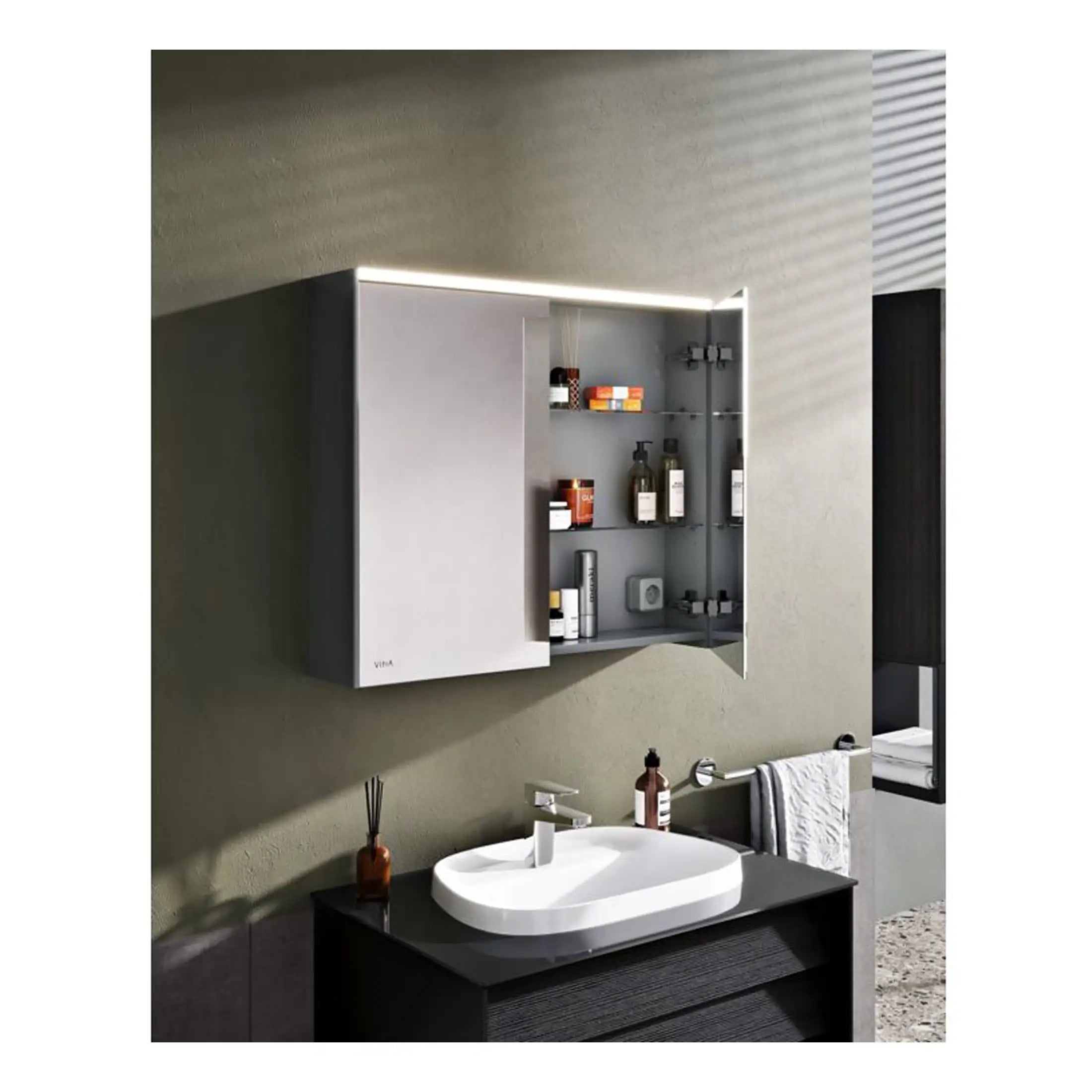 Sleek modern bathroom cabinet with integrated lighting and glass shelves, perfect for storing toiletries in a contemporary bathroom setting.