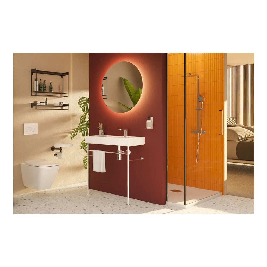 Modern bathroom with stylish fixtures, including a wall-mounted toilet, sleek sink, illuminated mirror, and bright orange tiled walk-in shower, creating a contemporary and functional space.