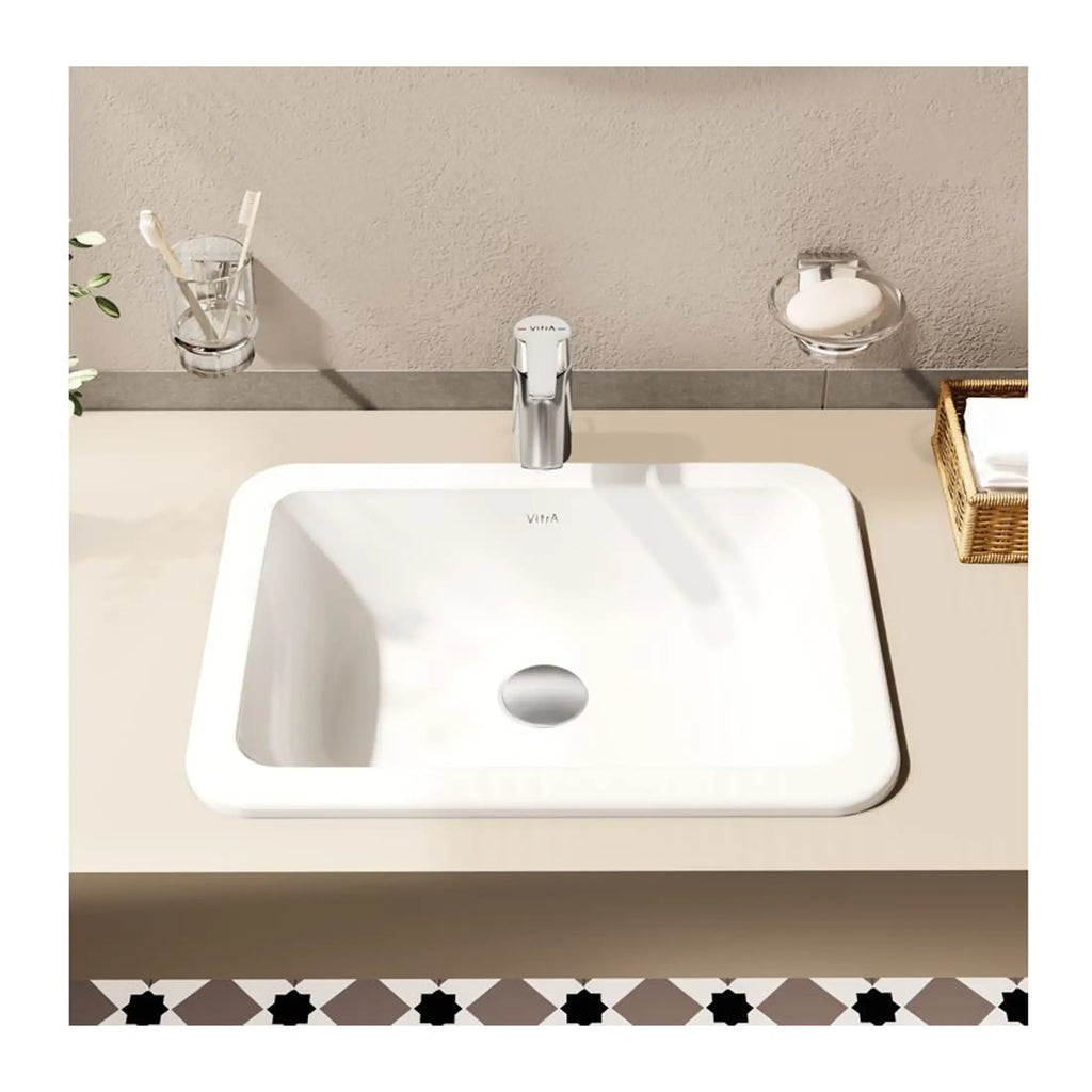 Sleek modern bathroom sink with a chrome faucet and minimalist design, showcasing elegant bathroom fixtures and accessories for a contemporary style.