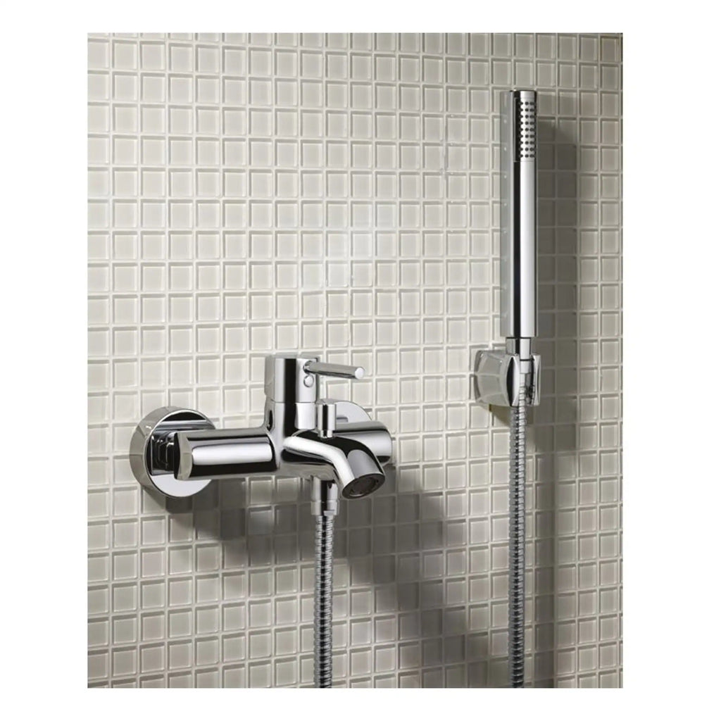 Shower mixer tap with handheld shower on tiled bathroom wall, chrome finish ideal for modern bathroom upgrades.