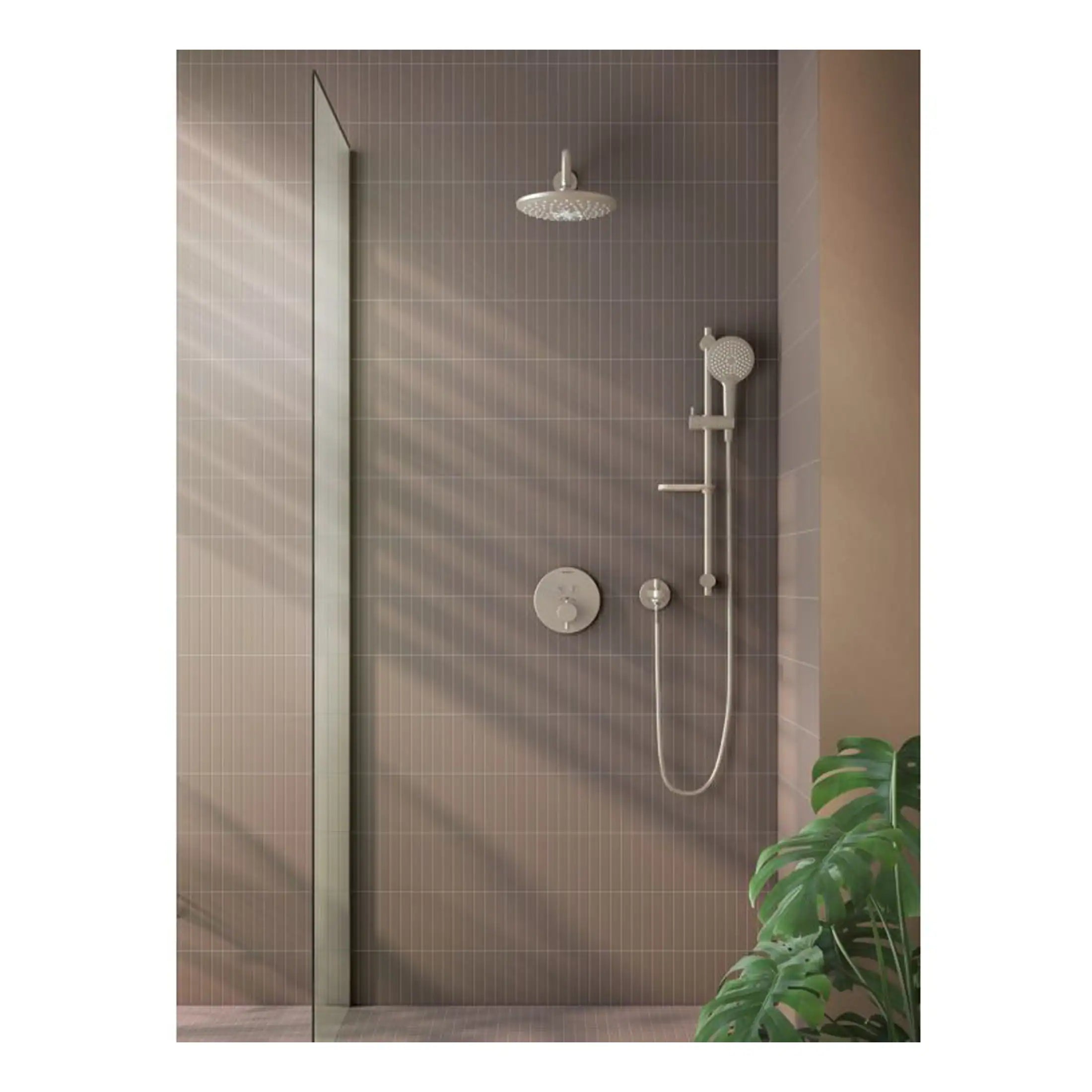 Elegant modern shower area with rain shower head, handheld shower, and wall controls, set against taupe tiled walls, creating a sleek and stylish bathroom design.