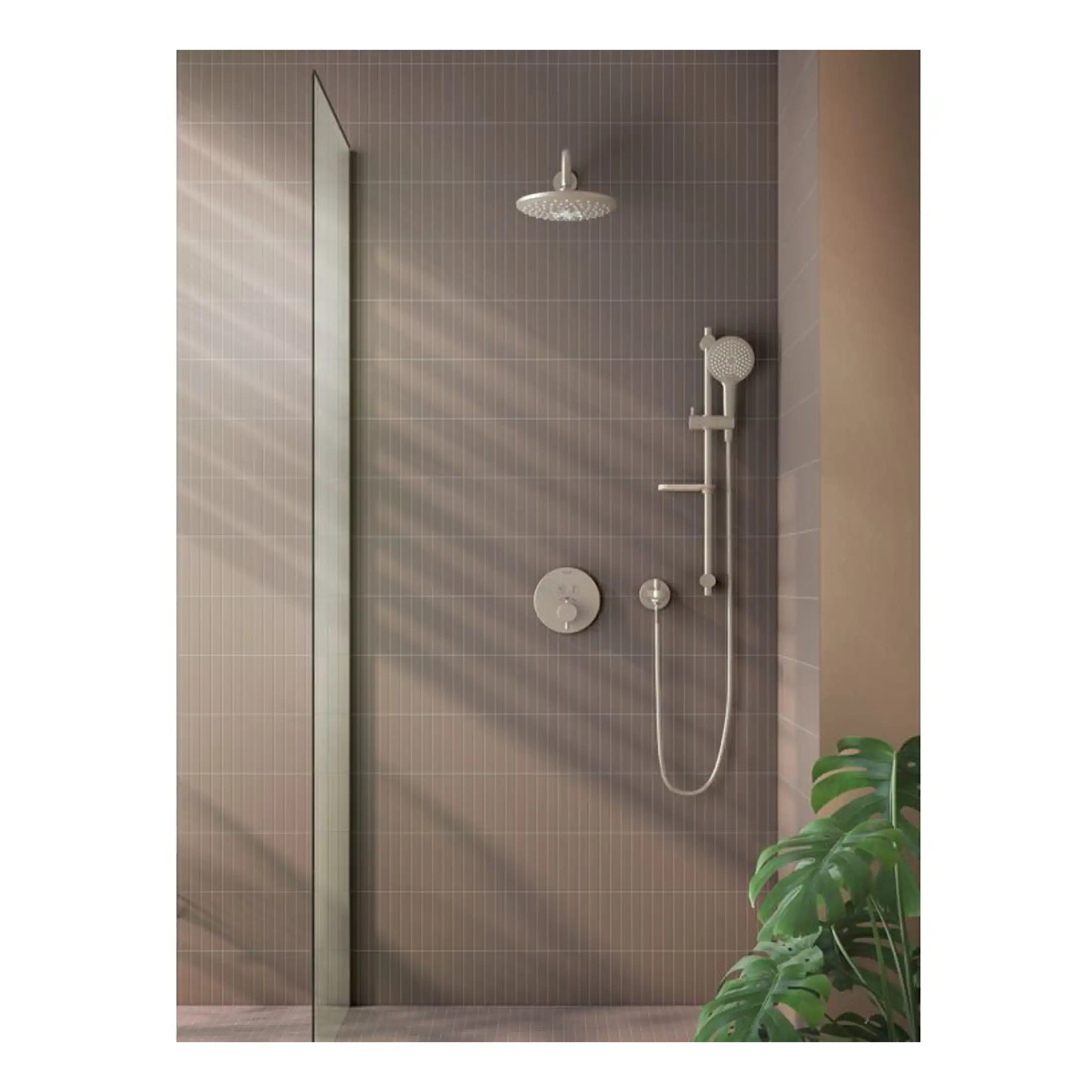 Modern walk-in shower with rainfall and handheld showerheads, beige tiled wall, glass partition, and lush green plant in a contemporary bathroom setting.