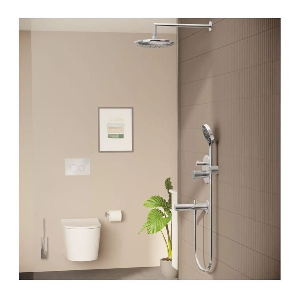 Modern bathroom with wall-mounted toilet, beige and brown tiled walls, and a sleek rainfall shower head with hand-held shower attachment. Featuring minimalist design and natural greenery for a spa-like feel.