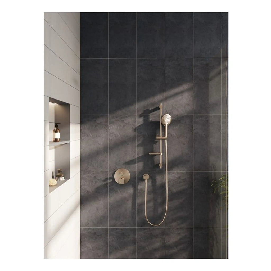 Sleek modern shower with matte brass fixtures and dark stone tiled wall in a contemporary Bubly Bathrooms design. Perfect for a stylish, luxurious bathroom update.
